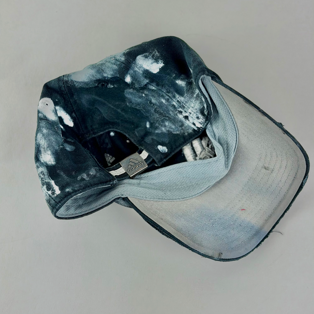 ASTROBOI* x Adidas 'Martyr' black and white faded studded rhinestone cap, rear view showing adjustable strap back.