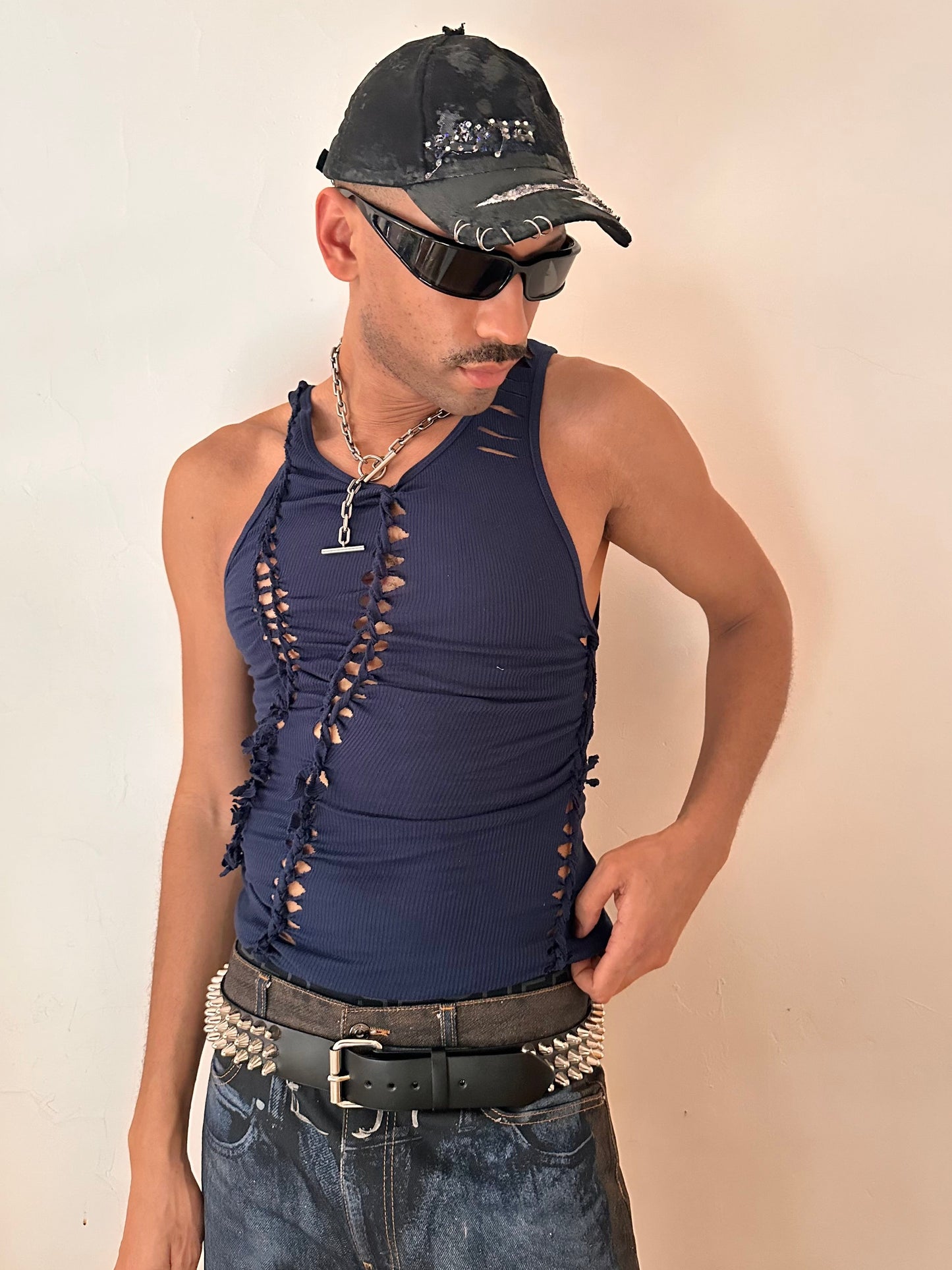 Male model wearing ASTROBOI* x Gildan 'Nebulae' navy braided twist tank top, styled full look, ASTROBOI* STUDIO NYC.
