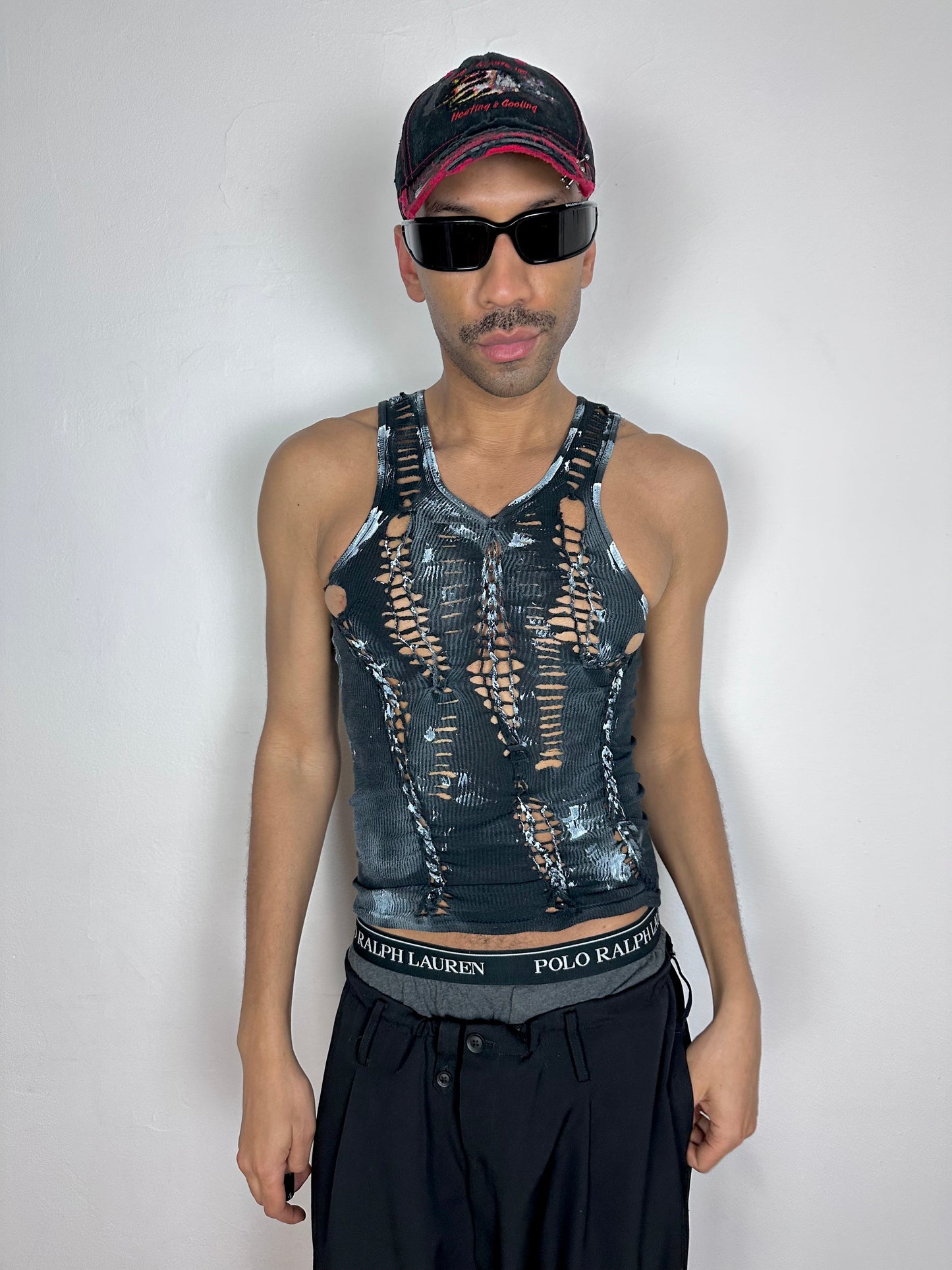 Male model wearing ASTROBOI* x Gildan 'White Out' black and white braided twist tank top, styled full look, ASTROBOI* STUDIO NYC.