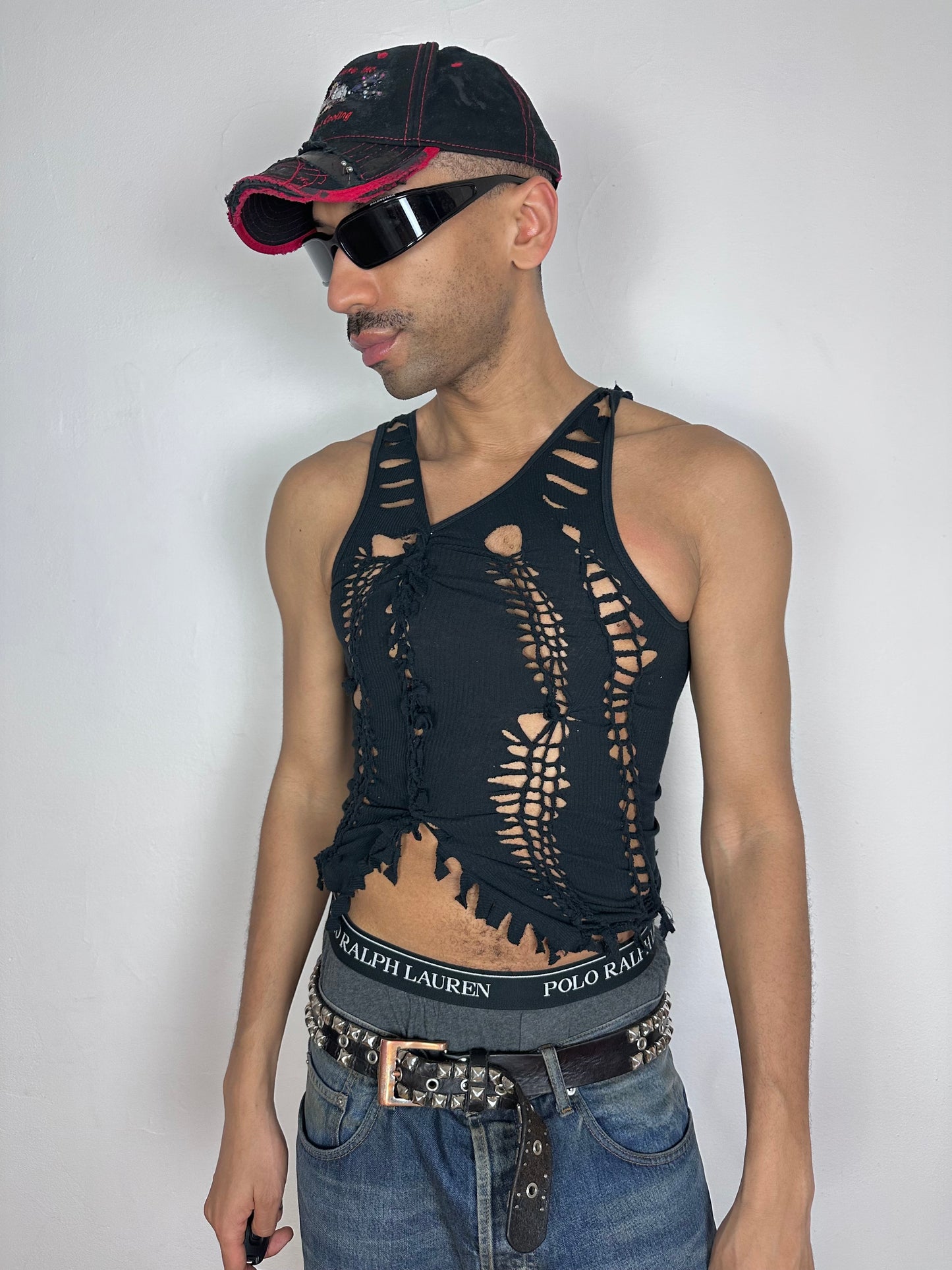 Male model wearing ASTROBOI* 'Andromeda' black braided twist tank top, styled full look, ASTROBOI* STUDIO NYC.