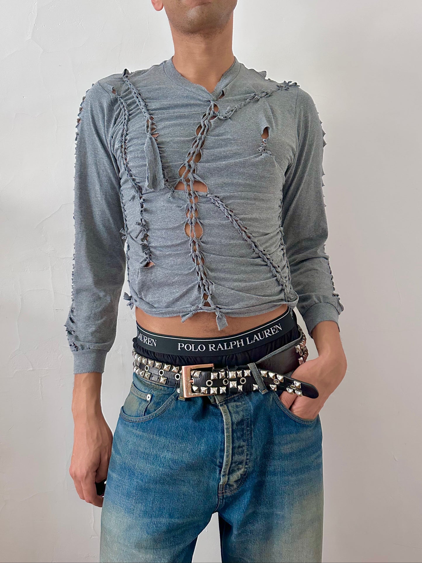 Male model wearing ASTROBOI* x Gildan 'Sl8' gray braided twist long sleeve t-shirt, styled full look, ASTROBOI* STUDIO NYC.