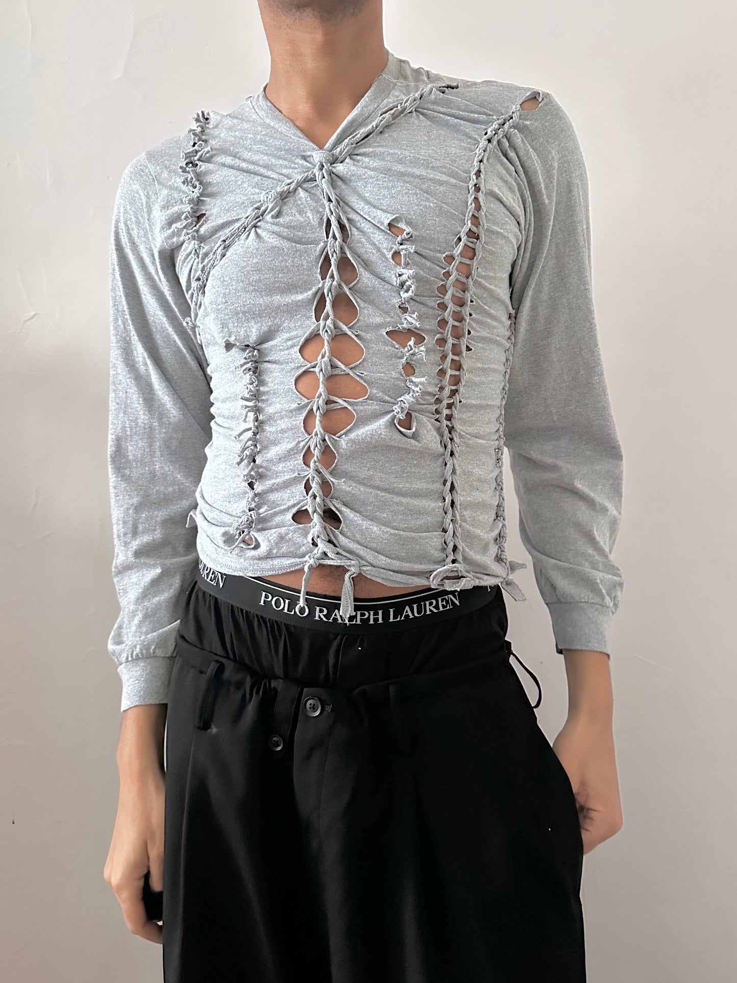 Male model wearing ASTROBOI* x Gildan 'Neutral' gray braided twist long sleeve t-shirt, styled full look, ASTROBOI* STUDIO NYC.