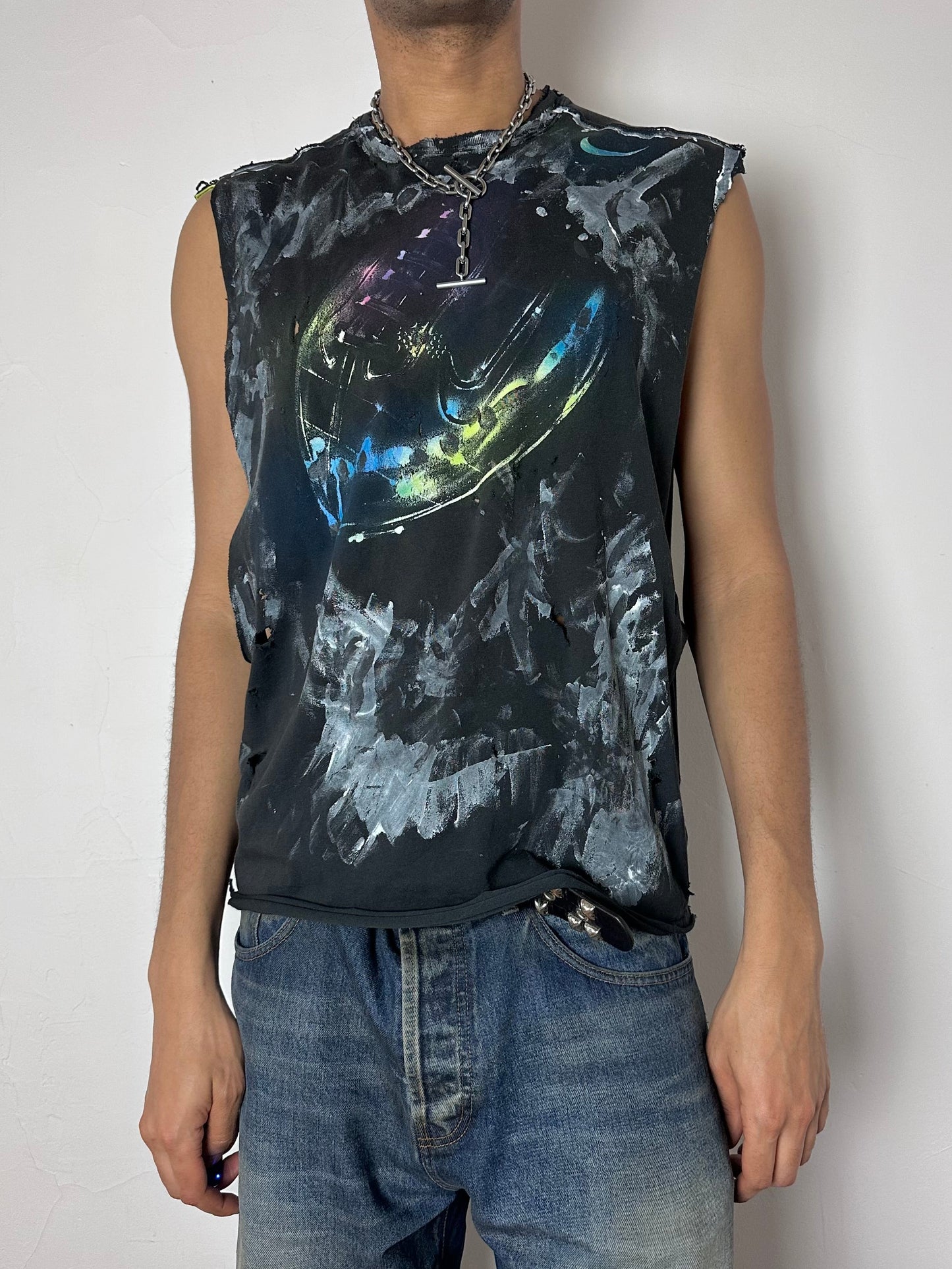 Male model wearing ASTROBOI* x Nike 'Celestial' navy football graphic muscle shirt, styled full look, ASTROBOI* STUDIO NYC.
