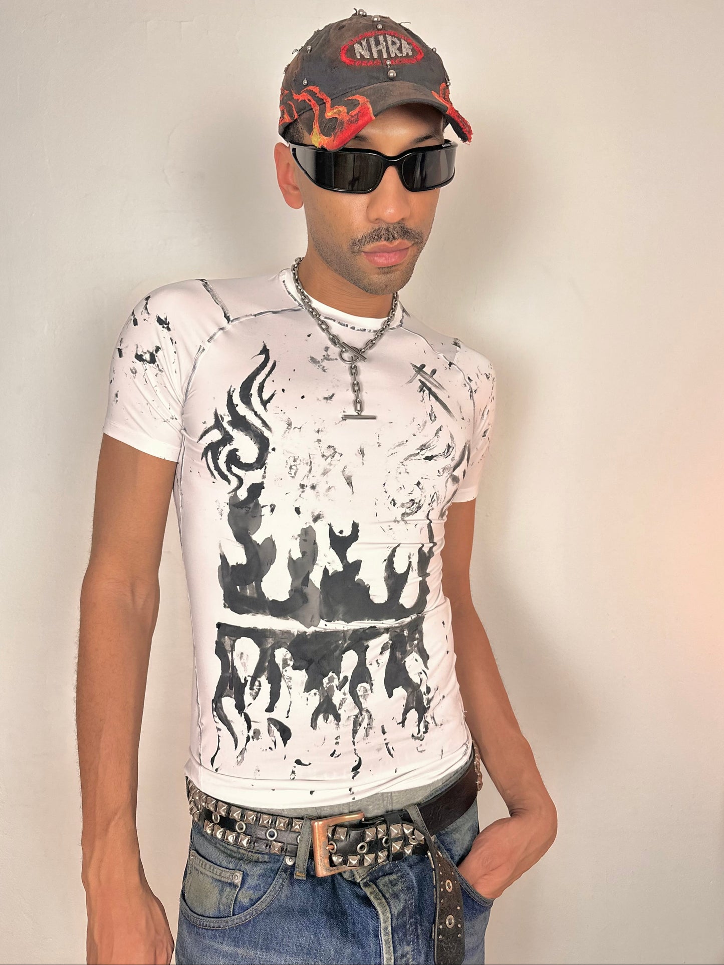 Styled image of ASTROBOI* Flames white and black tattoo print compression top with stretch fabric and tight fit, hand-painted design, size Medium