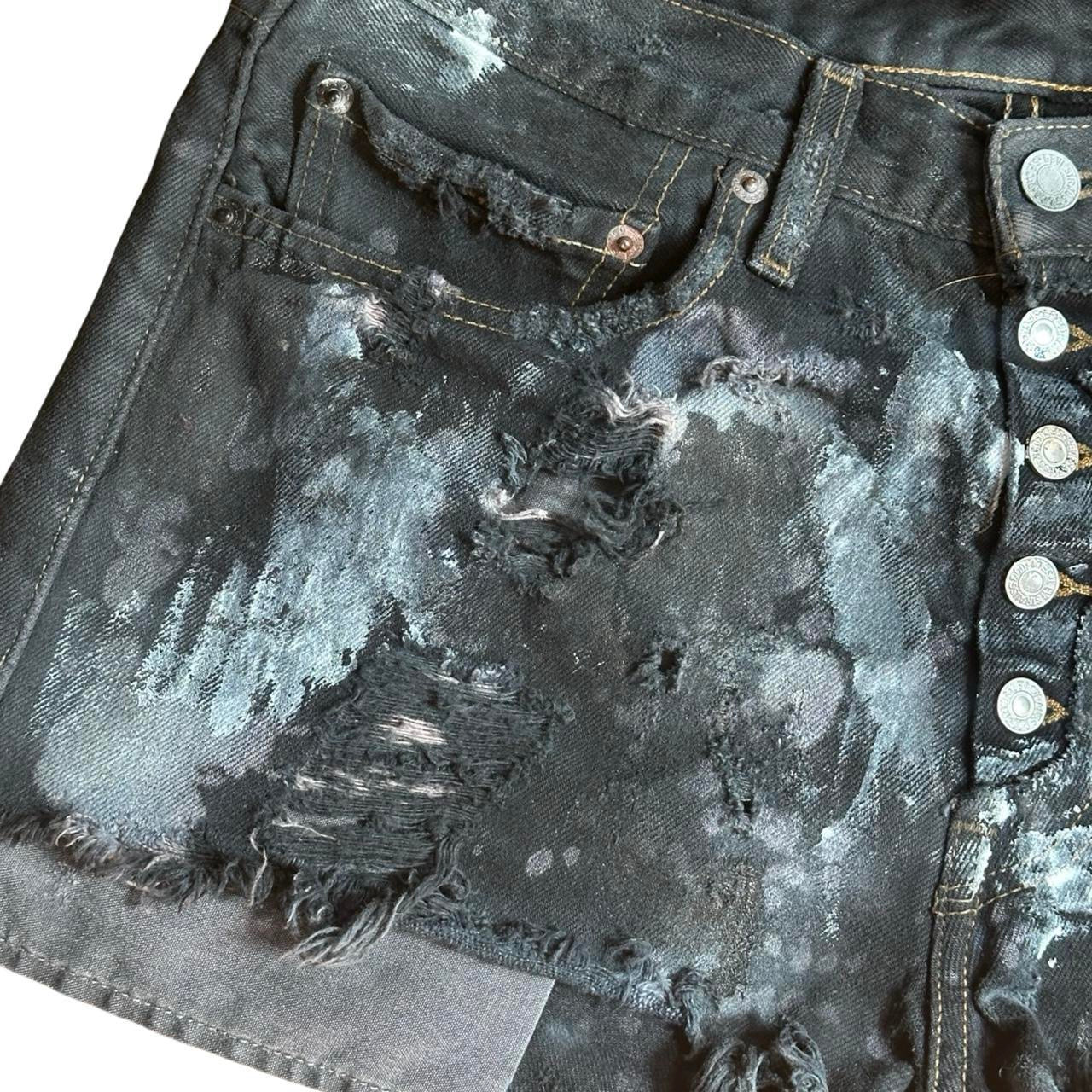 ASTROBOI* x Levi's Womens Ripped Black Denim Painted Mini Shorts - flat front left