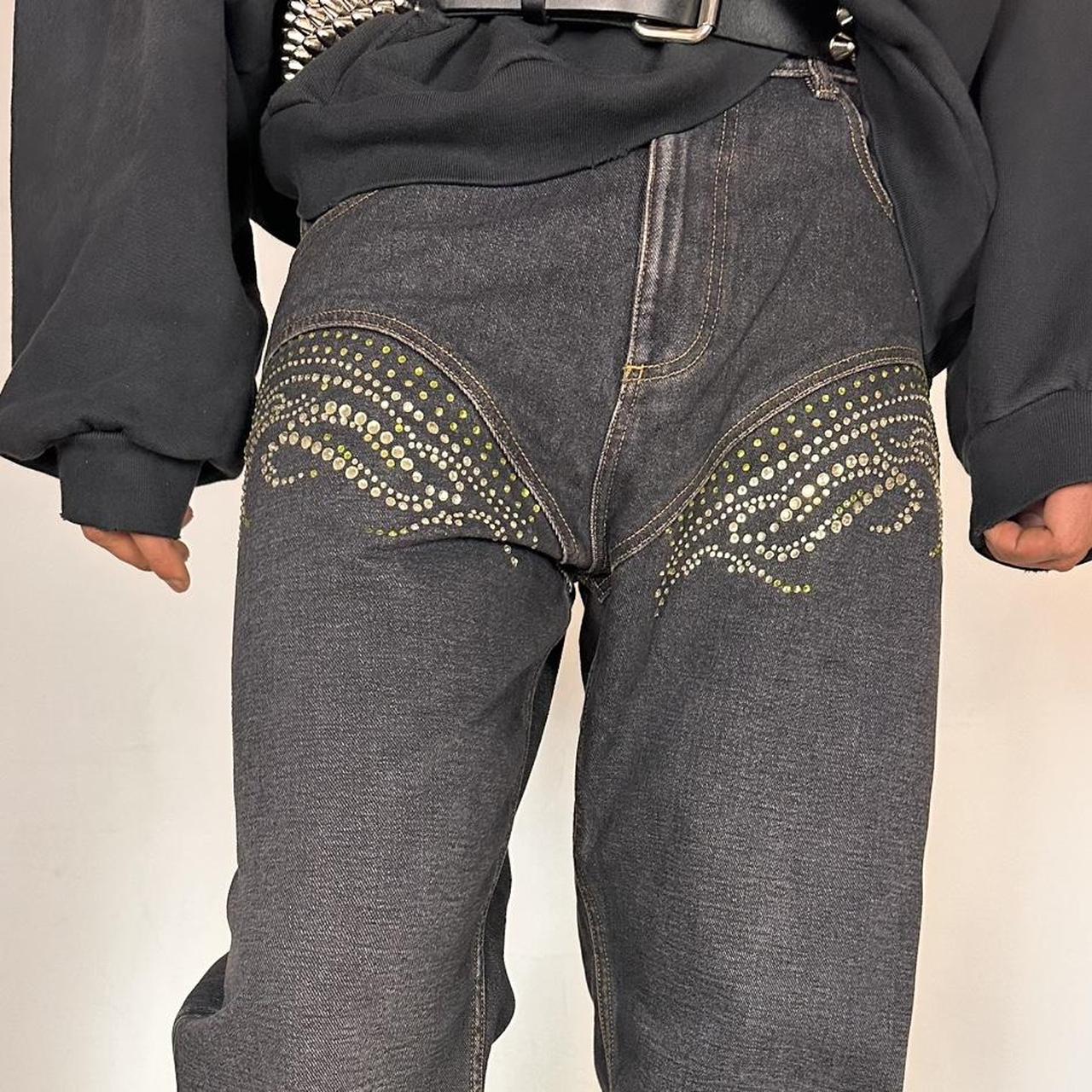 Close up of rhinestone details on Y/PROJECT black western cowboy jeans with green and clear rhinestones along both legs, straight-leg fit, size 36x32