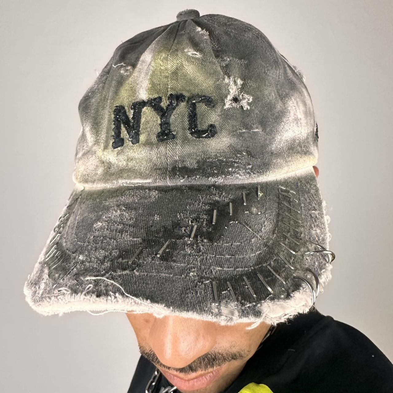 Details on ASTROBOI* white NYC dad hat with clear resin logo, black and green abstract paint details, adjustable strap back