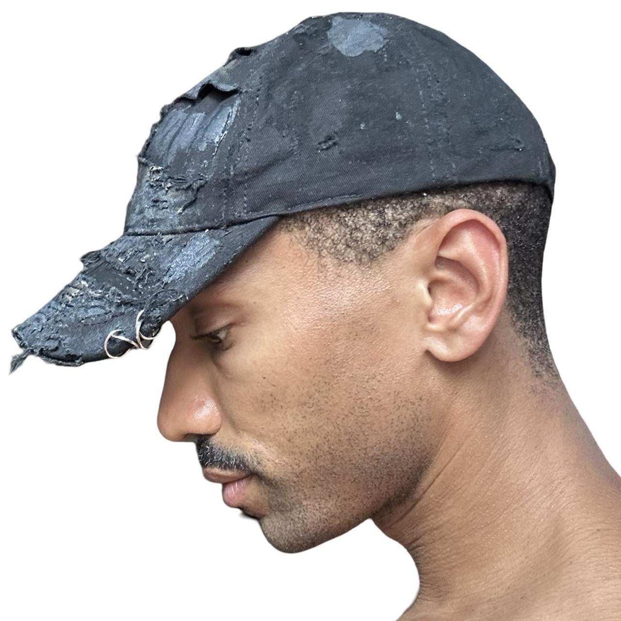 ASTROBOI* black distressed denim hat with faded finish, layered black paint, and sterling silver piercings, customized in NYC left silhouette