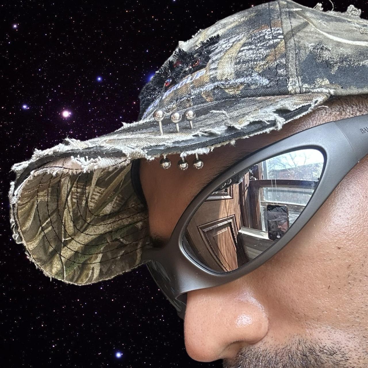 ASTROBOI* 'DSG' Brown Camouflage Pierced Rhinestone Hat - piercing details
