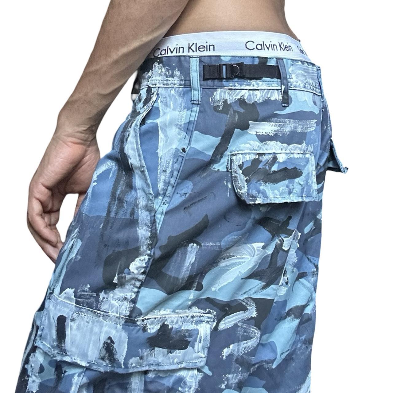 ASTROBOI* x ROTHCO Painted Blue Camouflage Utility Shorts - left close up