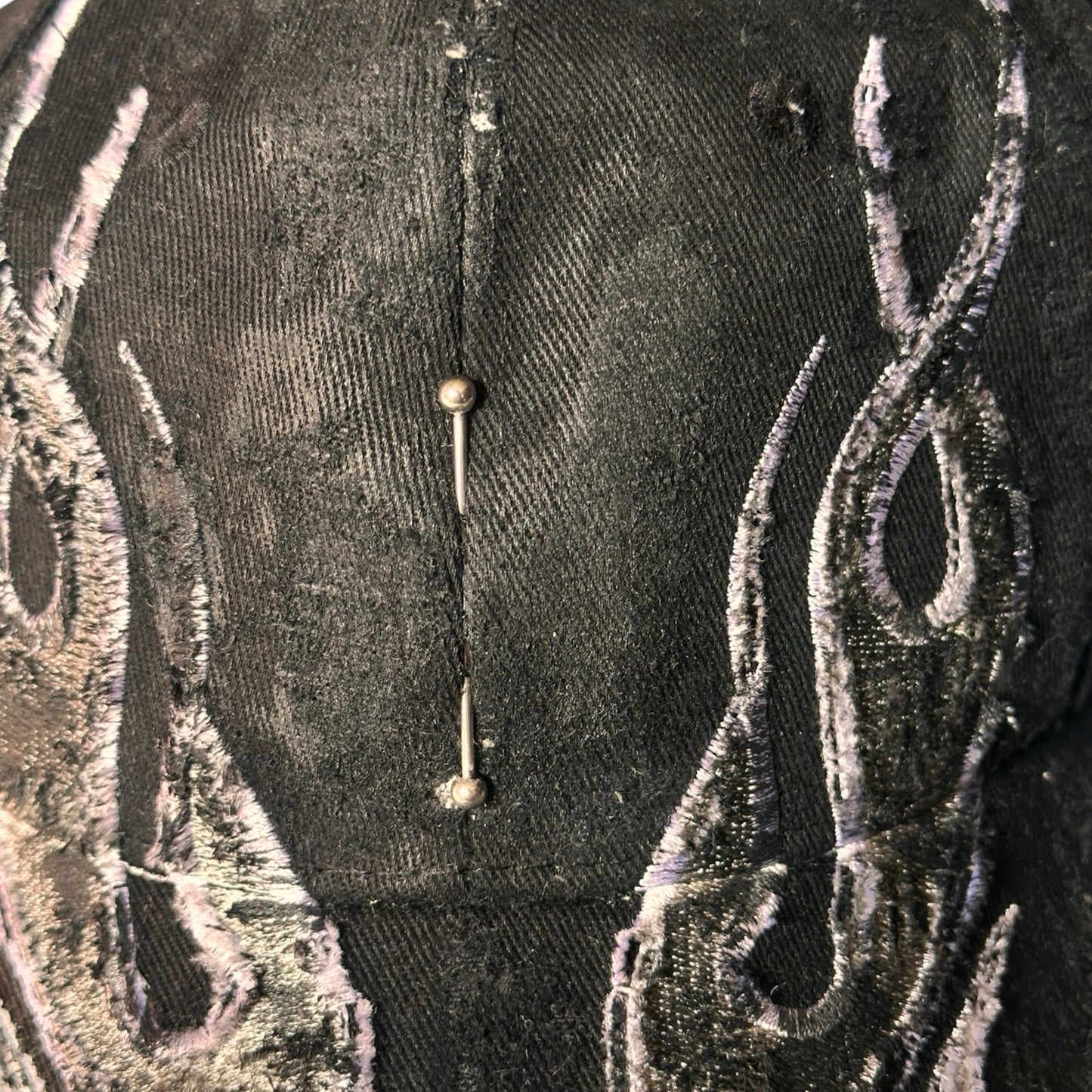 ASTROBOI* 'Black Flame' Y2K Black & Silver Distressed Pierced Hat - flat front detail