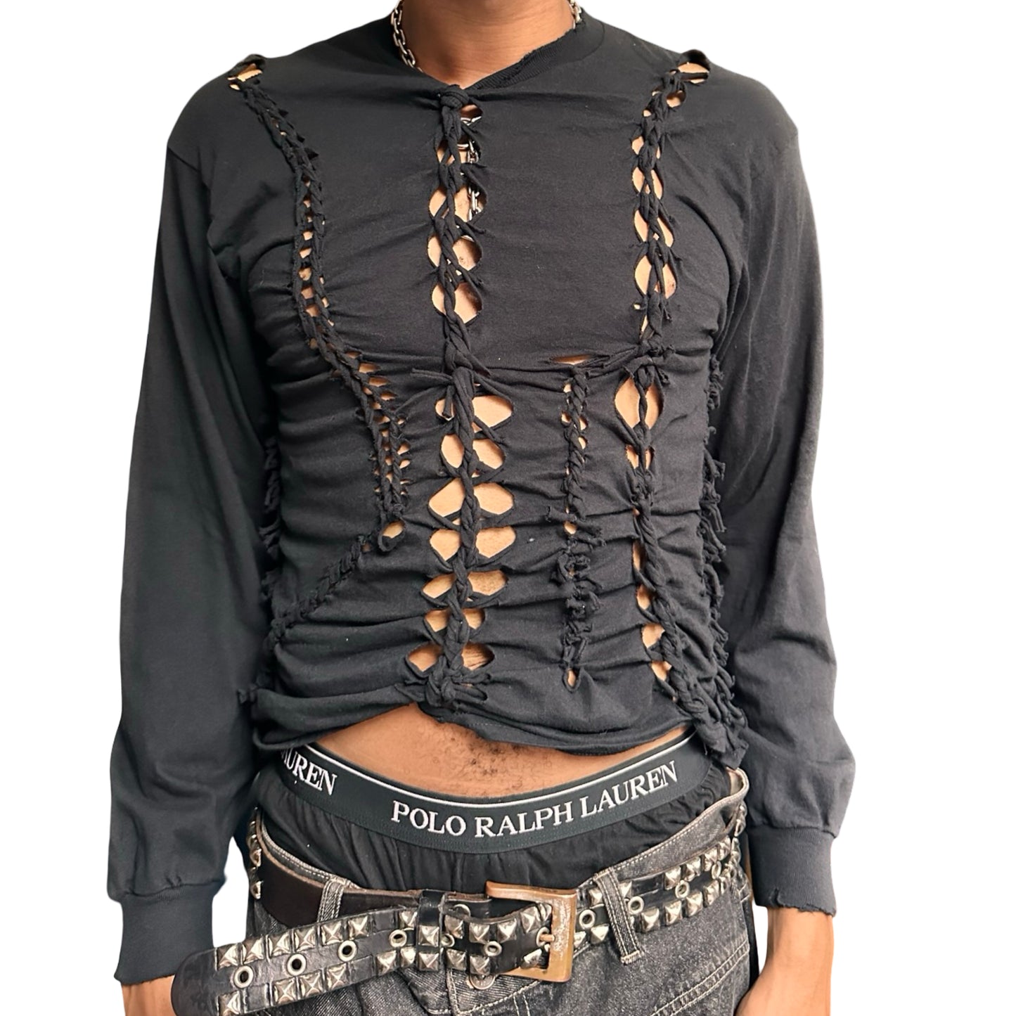 Black long-sleeve shirt with braided front worn by a person. This top is perfect for festivals and parties
