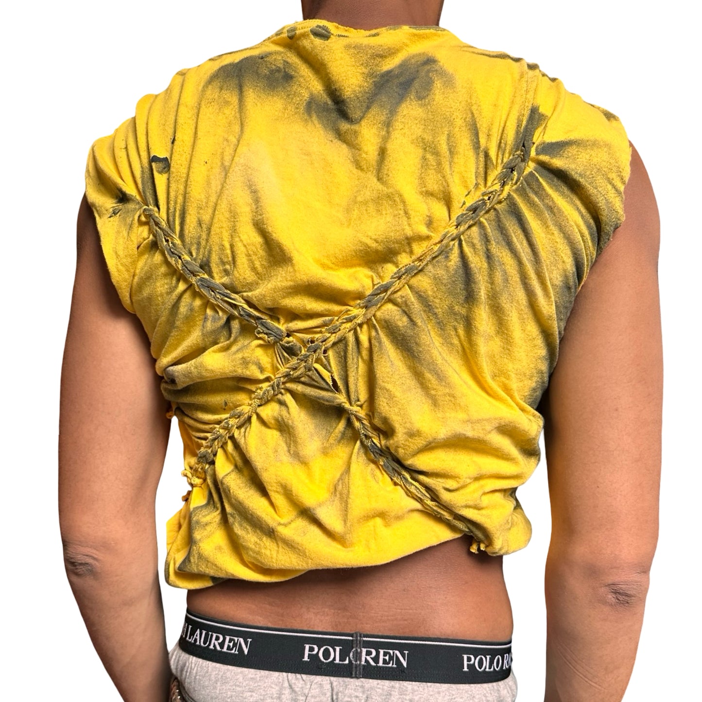 Yellow braided shirt worn by a person on a white background