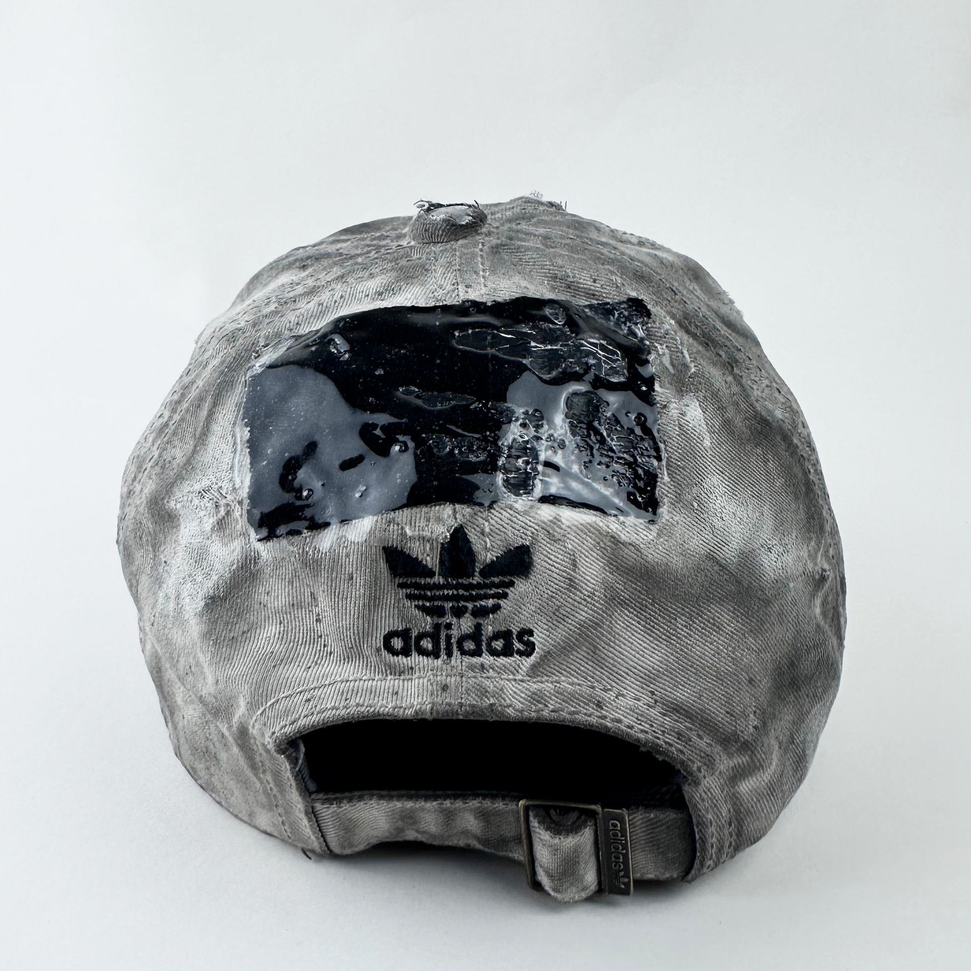 ASTROBOI* x Adidas 'H Chic' tan distressed grunge hat, rear view showing black duct tape accent detail and adjustable strap.