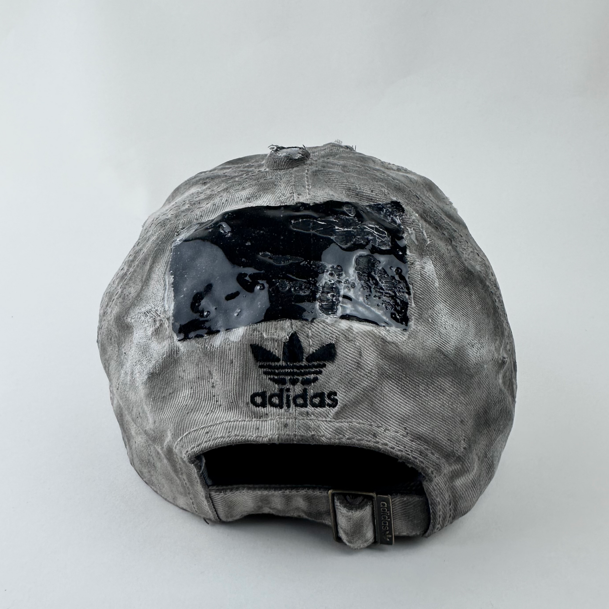 ASTROBOI* x Adidas 'H Chic' tan distressed grunge hat, rear view showing black duct tape accent detail and adjustable strap.