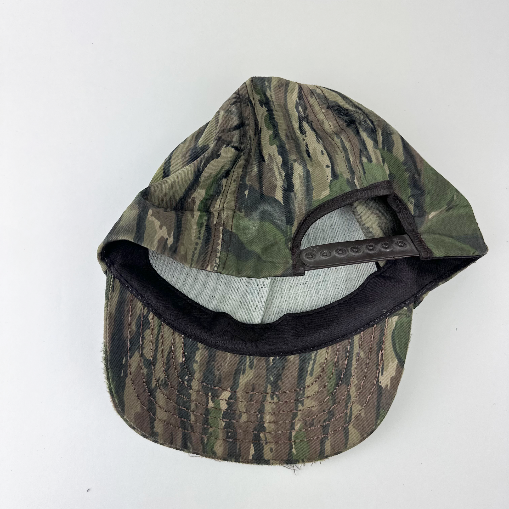 ASTROBOI* x Betz brown Real Tree camo doodle hat, rear view showing adjustable strap back.