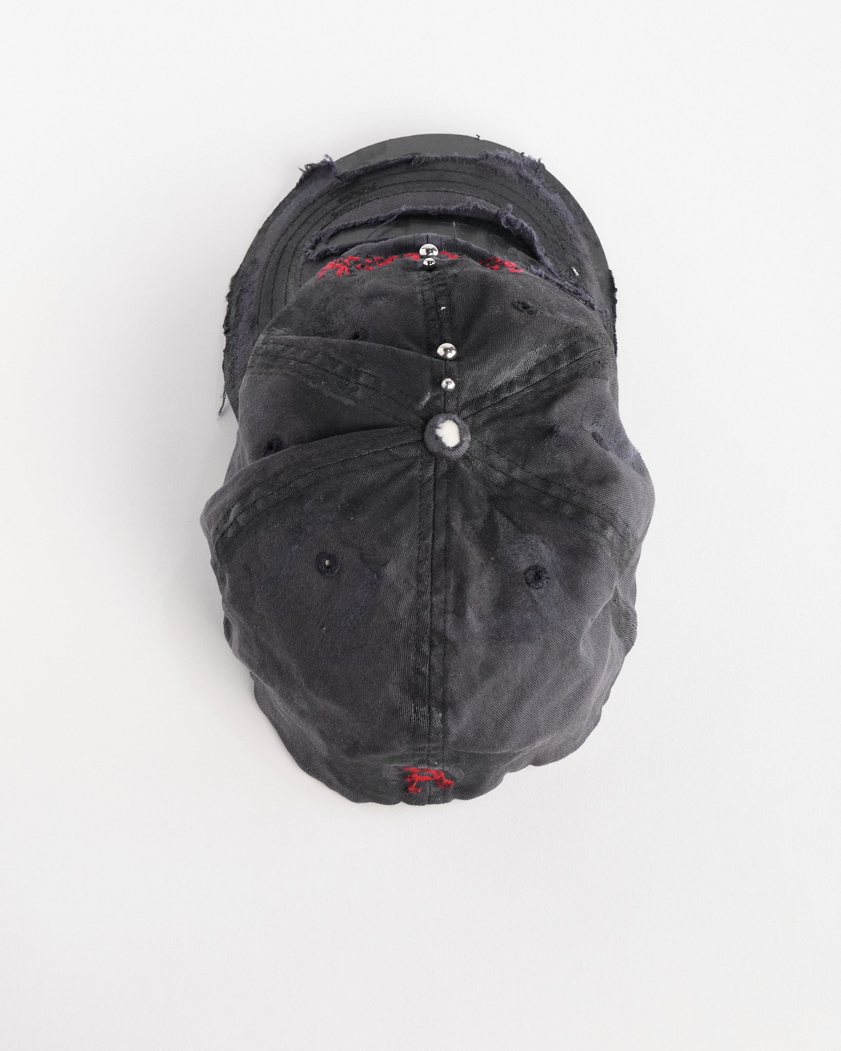 Top of Navy ASTROBOI* x Abercrombie hat with distressed paint, stainless steel piercings, and logo embroidery on front and back, customized in NYC.