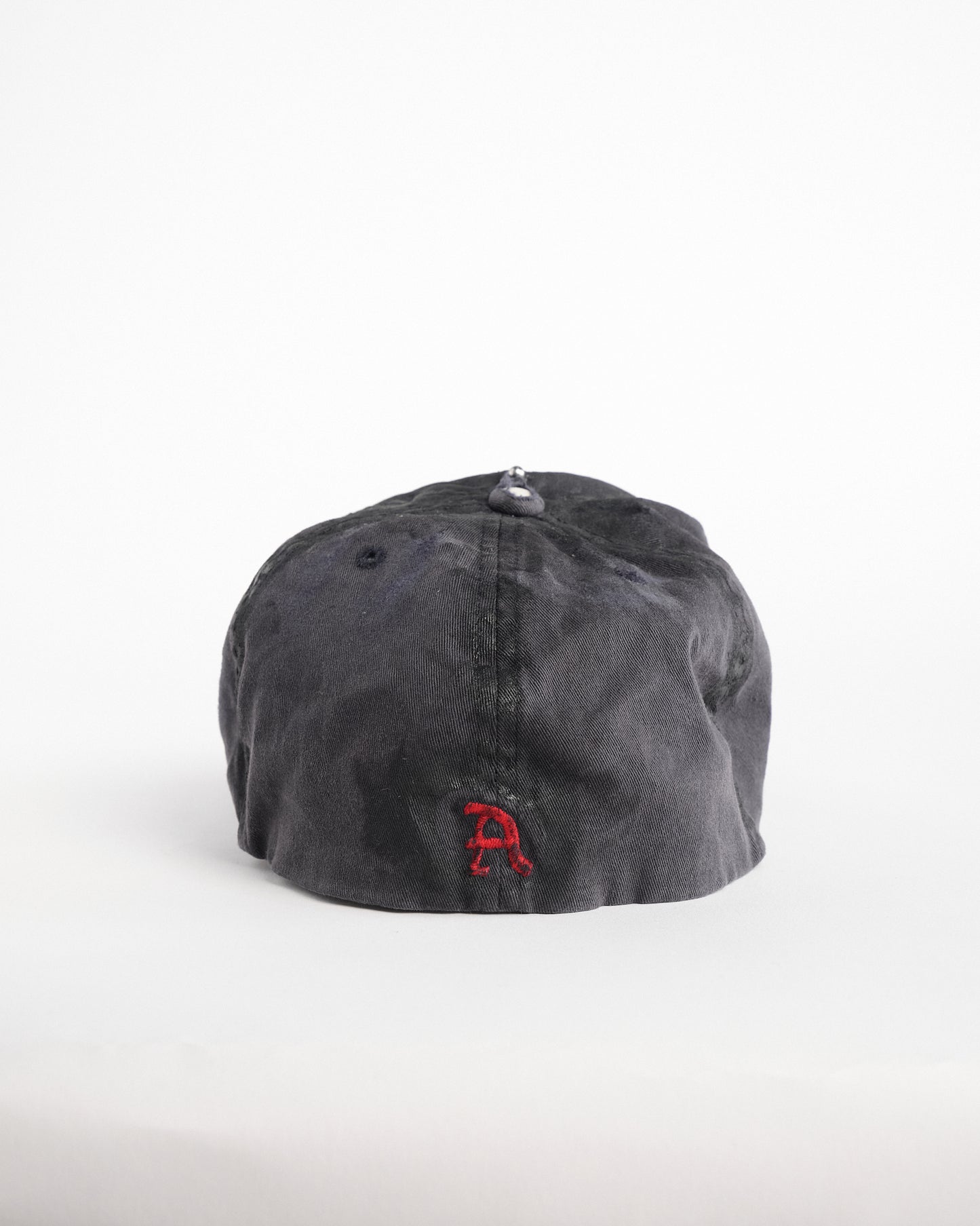 Back of Navy ASTROBOI* x Abercrombie hat with distressed paint, stainless steel piercings, and logo embroidery on front and back, customized in NYC.