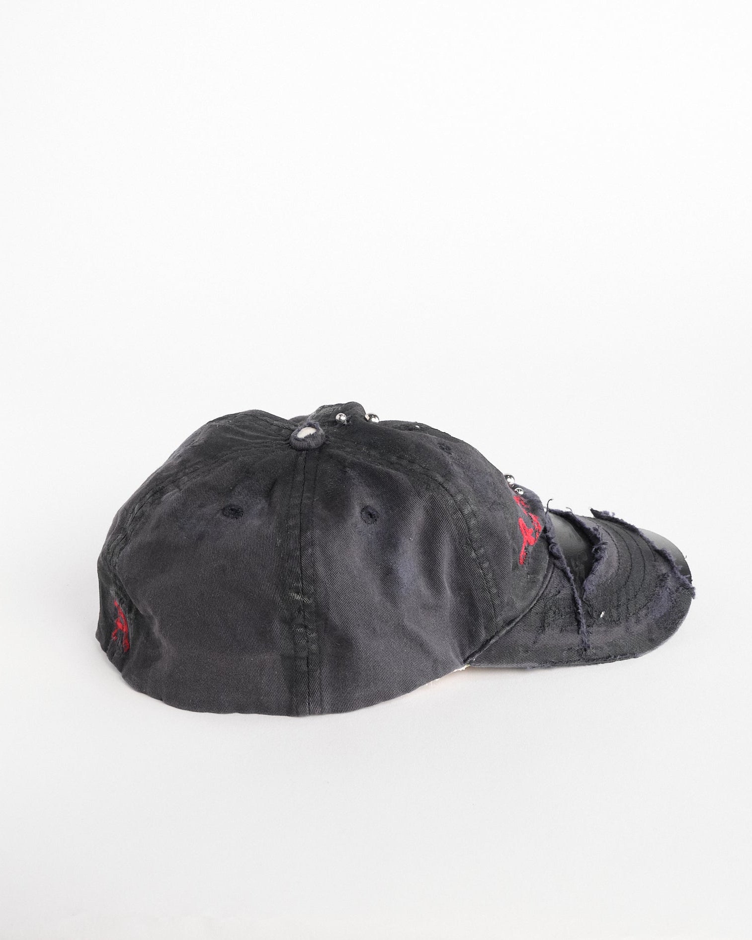 Front of Navy ASTROBOI* x Abercrombie hat with distressed paint, stainless steel piercings, and logo embroidery on front and back, customized in NYC.