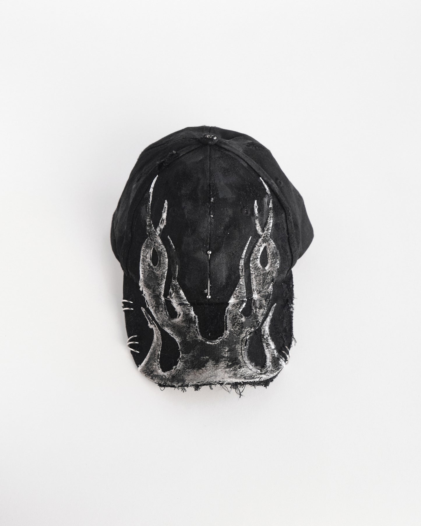Front overview of ASTROBOI* 'Black Flame' Y2K Black & Silver Distressed Pierced Hat 
