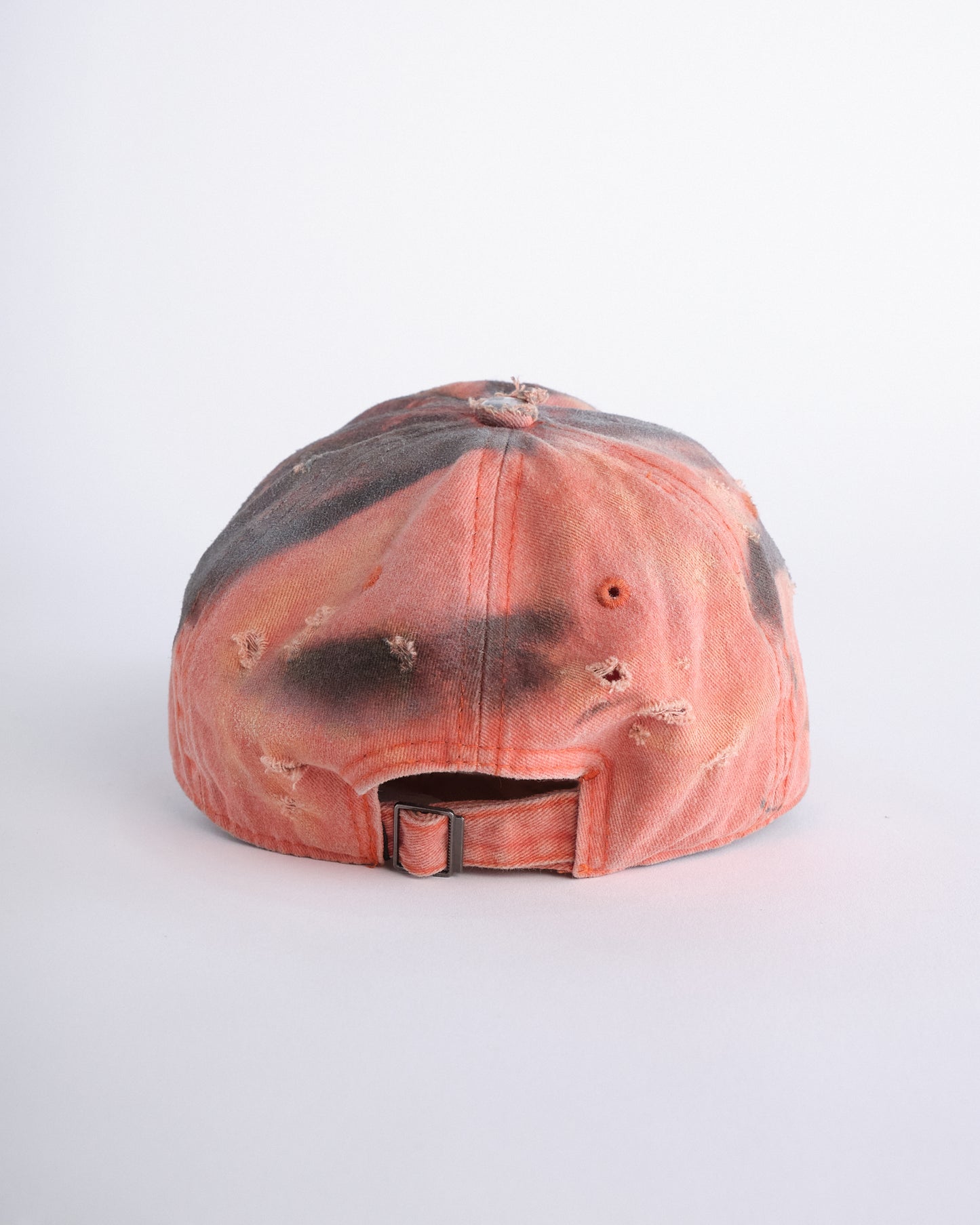 Back of ASTROBOI* Costa Rica orange distressed hat with rhinestones, black resin accents, stainless steel piercings, and adjustable strap, handmade in NYC.