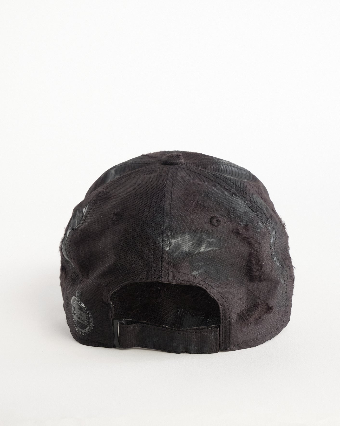 Back of Black Adidas hat customized by ASTROBOI* with distressing, black painted accents, and stainless steel piercings.