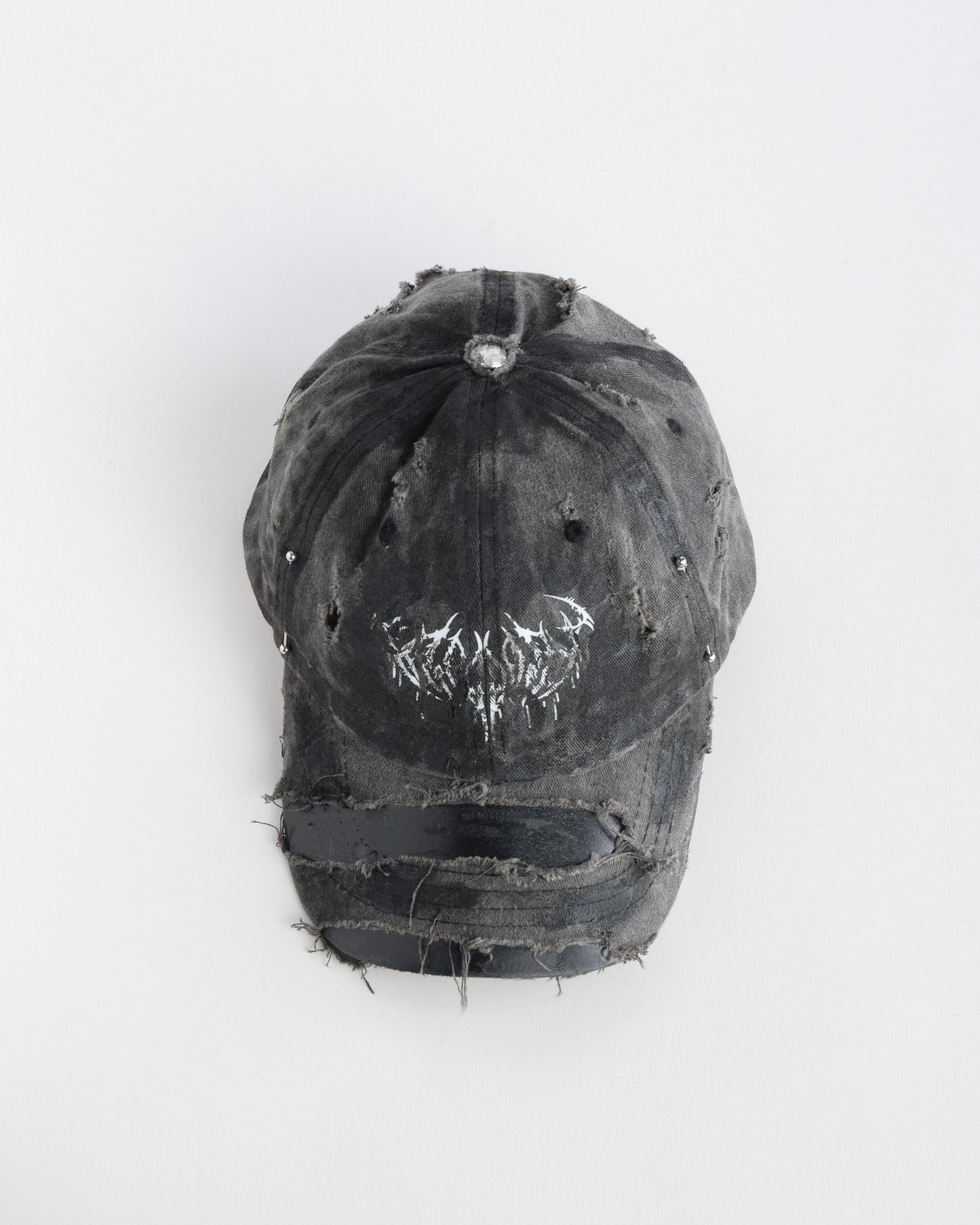 Top of ASTROBOI* indie grunge black distressed hat with barbed wire logo, adjustable strap, and hand-painted raw streetwear detailing, handmade in NYC.