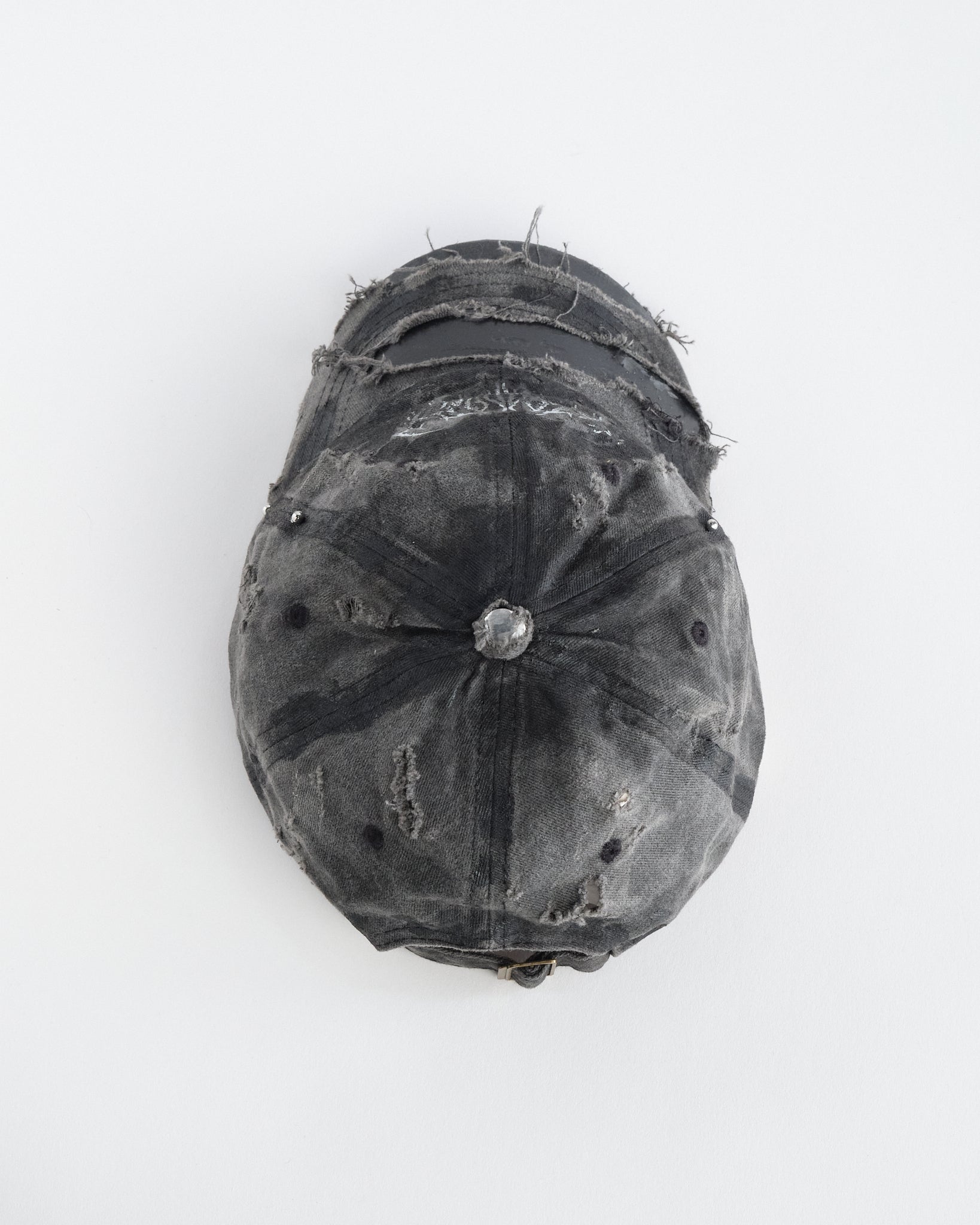 Top of ASTROBOI* indie grunge black distressed hat with barbed wire logo, adjustable strap, and hand-painted raw streetwear detailing, handmade in NYC.