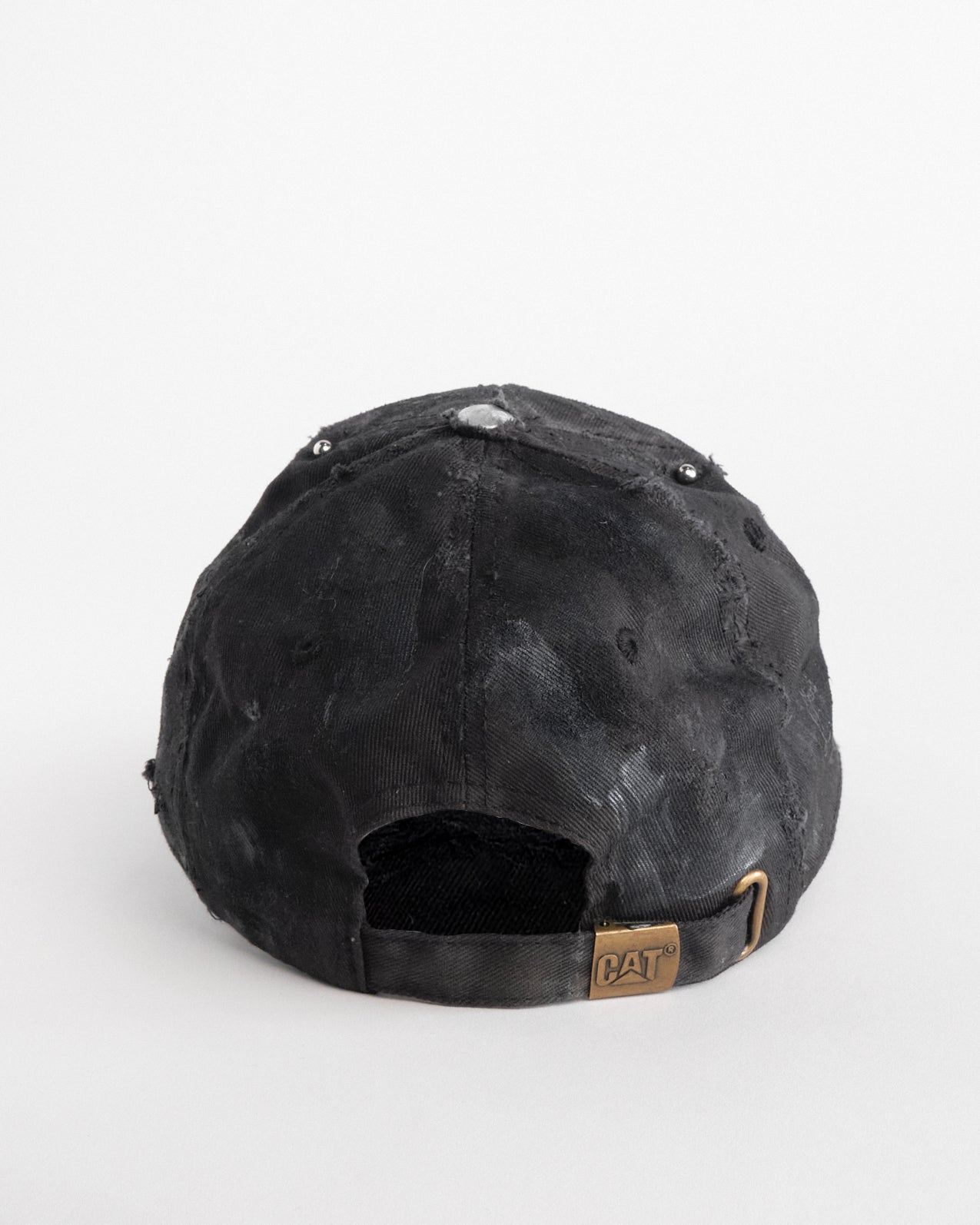 Back of ASTROBOI* x CAT black distressed pierced hat with rhinestone logo, resin and paint detailing, deconstructed visor, adjustable strap, handmade in NYC.