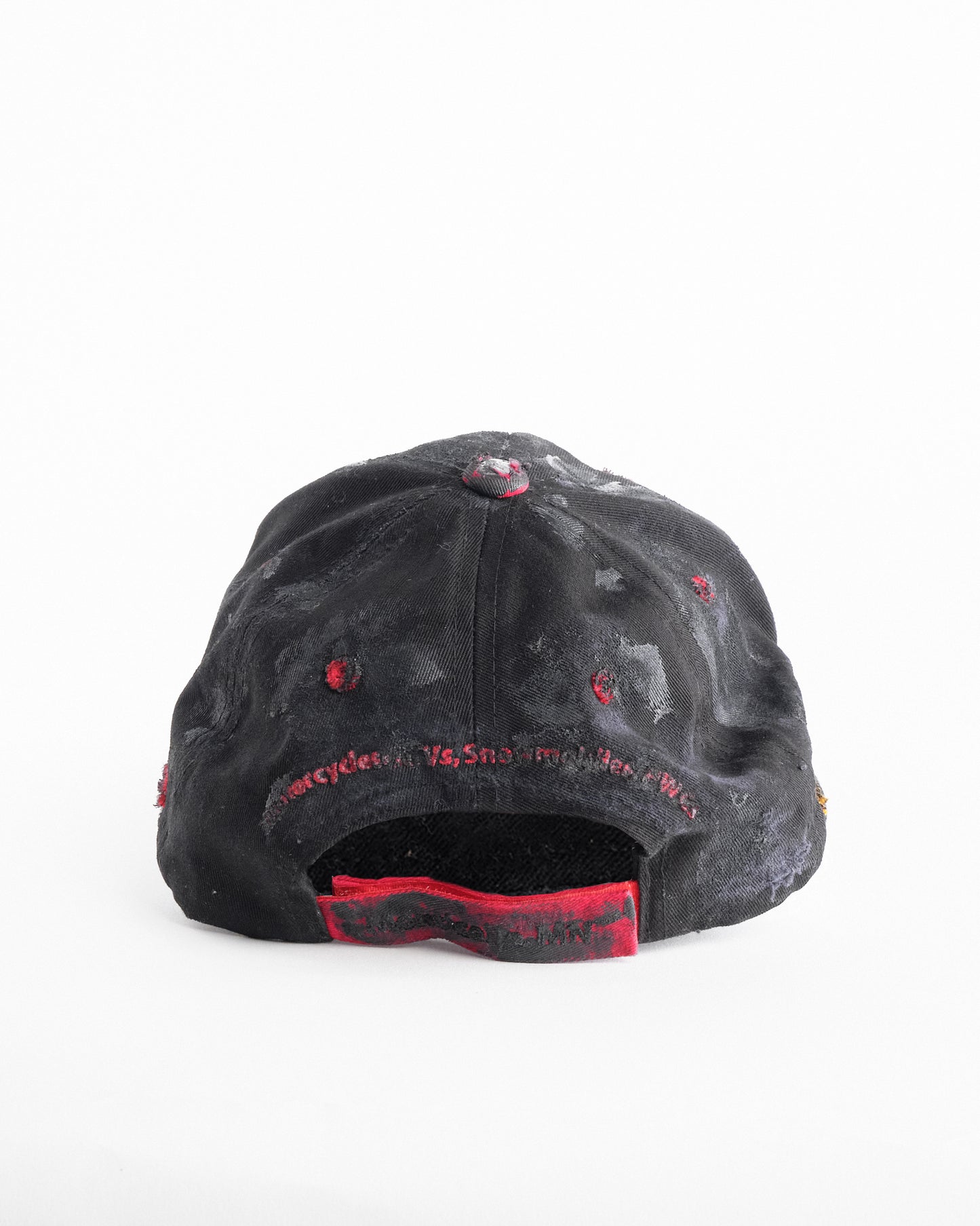 Back of ASTROBOI* x Kawasaki black distressed hat with pierced logo, deconstructed visor, stainless steel piercings, adjustable strap, handmade in NYC.