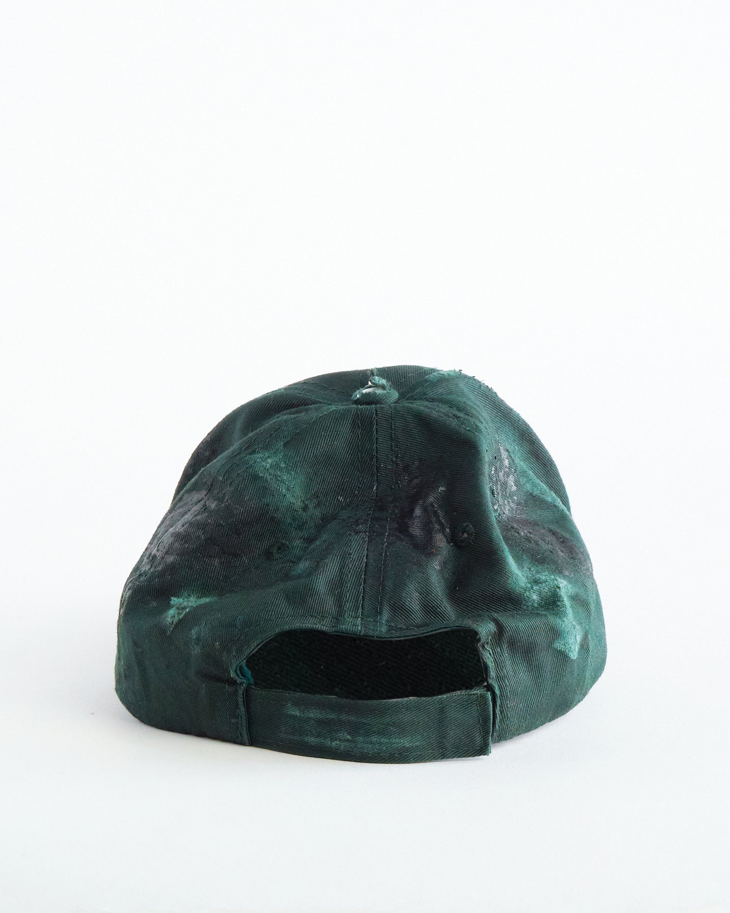 Back of ASTROBOI* Rocco Bros green construction hat with black grease distressing, stainless steel piercings, adjustable strap, handmade in NYC.