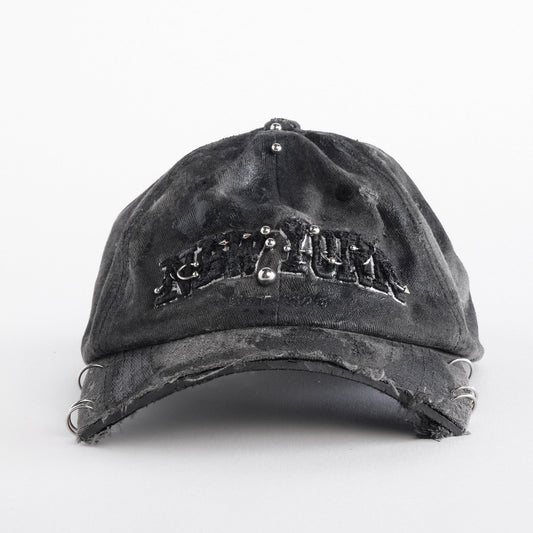 Front of Black half-visor “New York” hat with embroidered front logo, stainless steel piercings, and an adjustable strap.