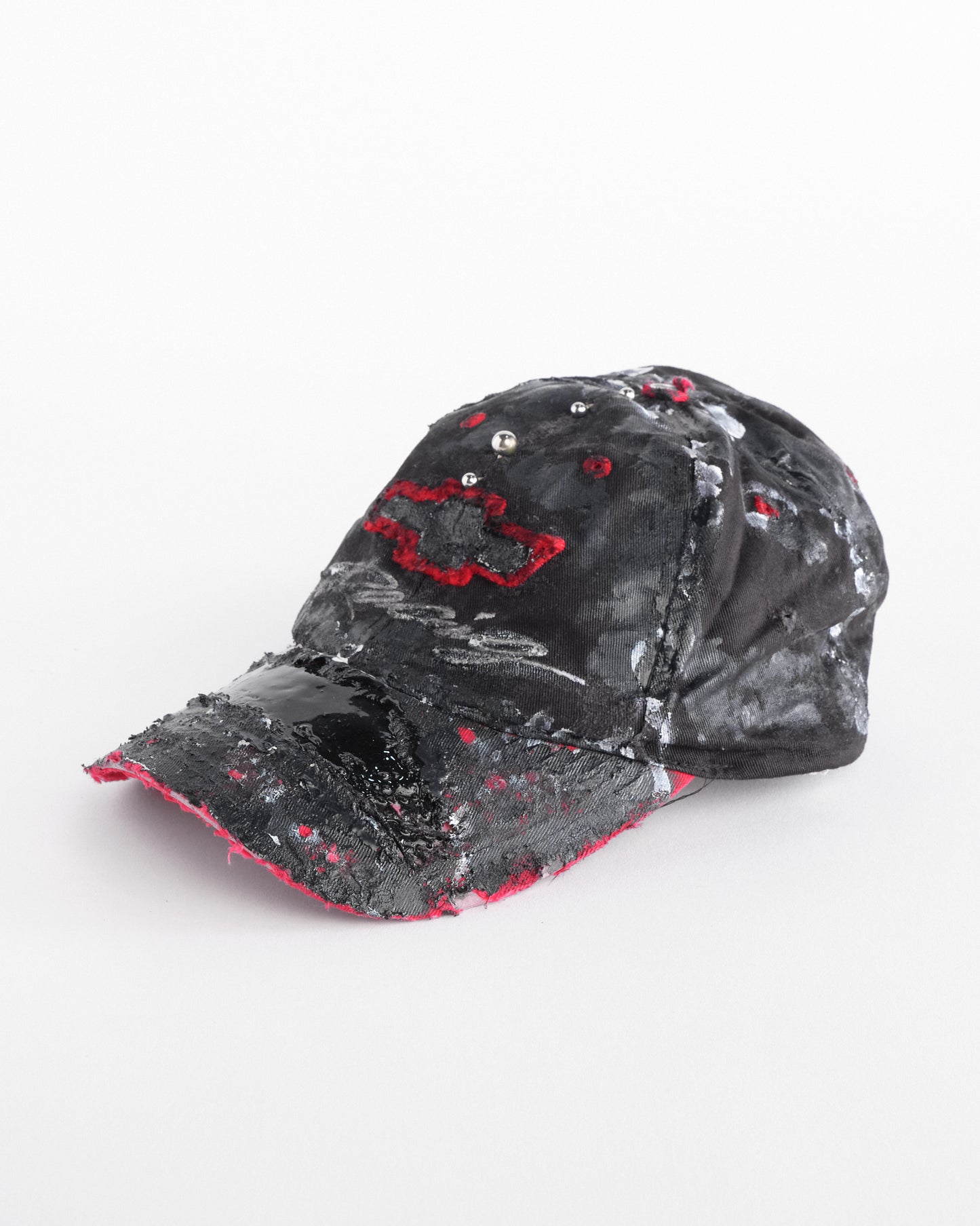 Left side of Black and red Chevy Racing hat customized by ASTROBOI* with distressing, painted details, glossy resin visor, and stainless steel piercings.
