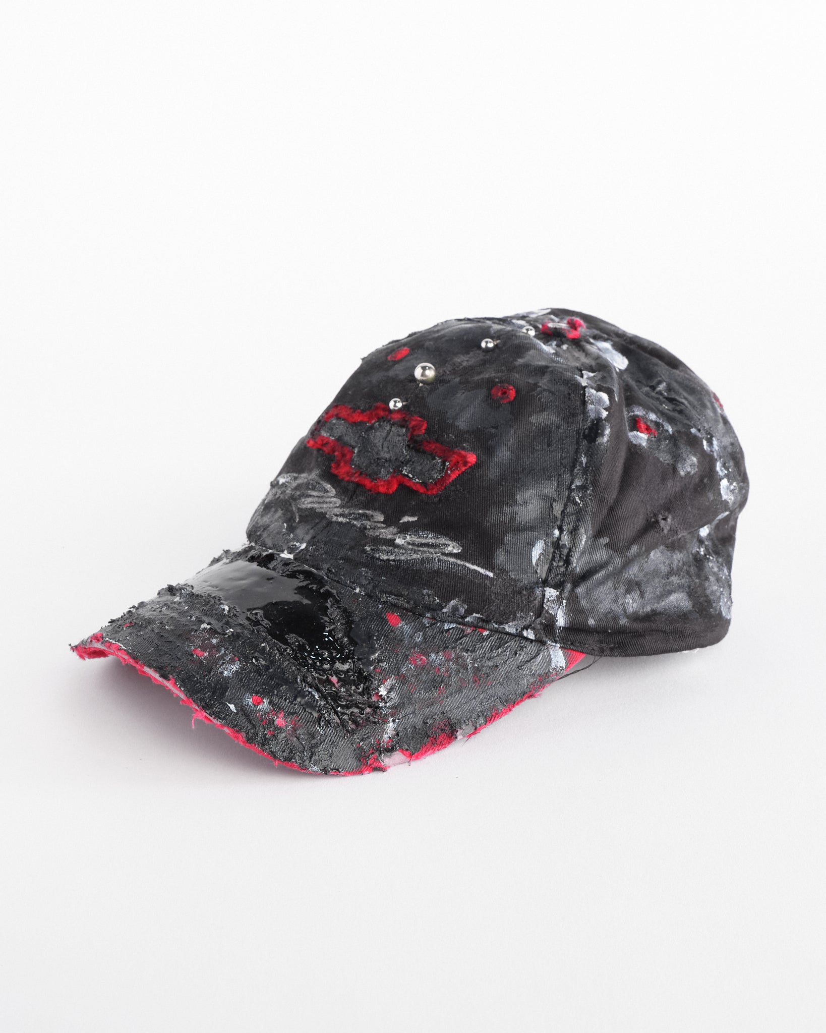 Left side of Black and red Chevy Racing hat customized by ASTROBOI* with distressing, painted details, glossy resin visor, and stainless steel piercings.