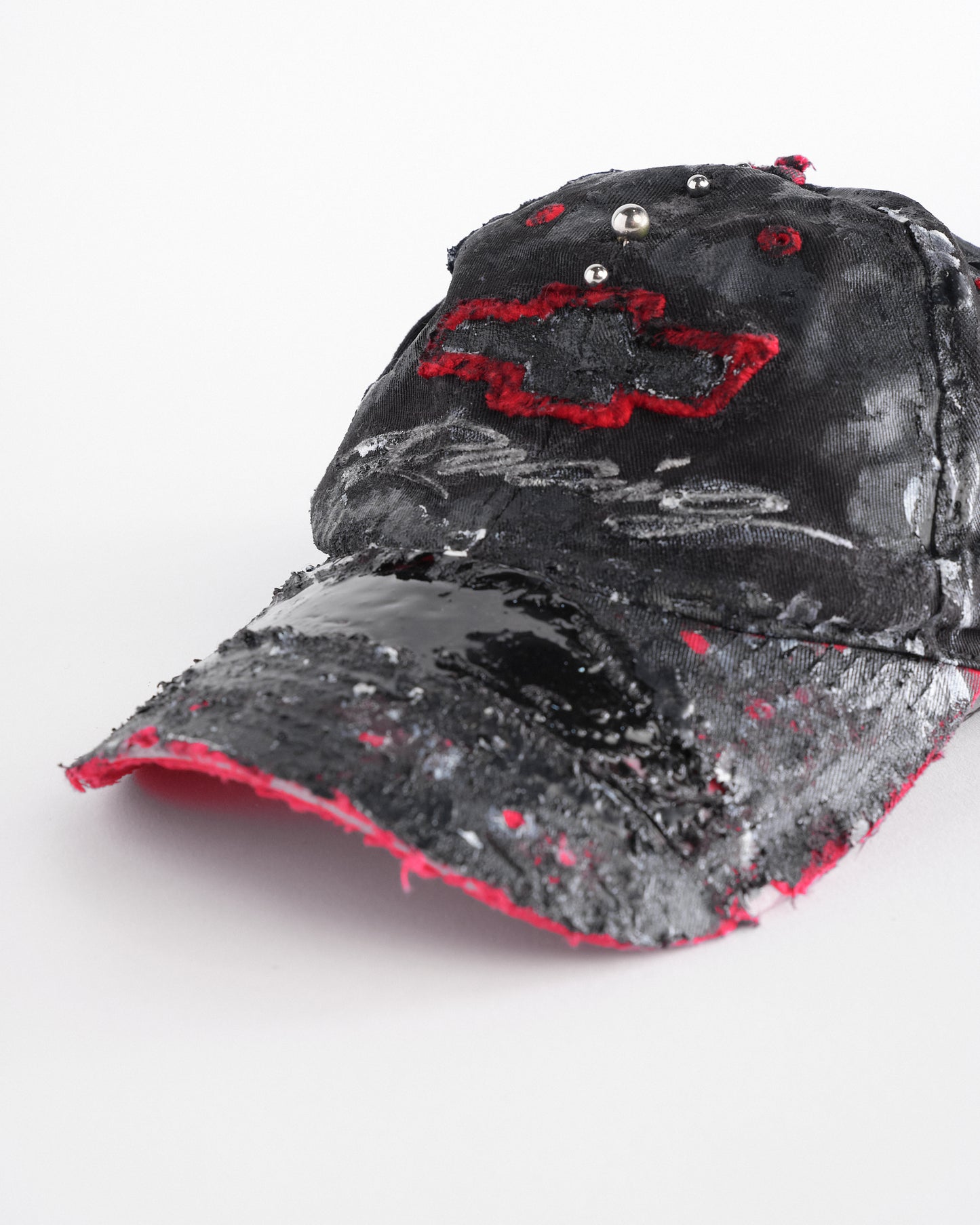 Visor detail of Black and red Chevy Racing hat customized by ASTROBOI* with distressing, painted details, glossy resin visor, and stainless steel piercings.