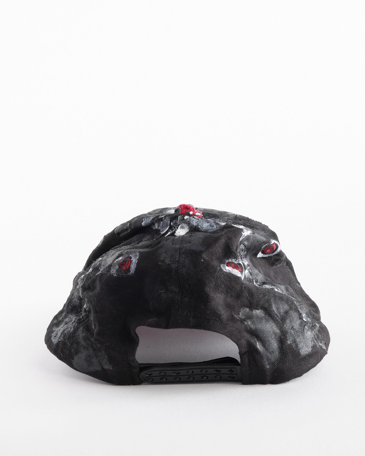 Back of of Black and red Chevy Racing hat customized by ASTROBOI* with distressing, painted details, glossy resin visor, and stainless steel piercings.