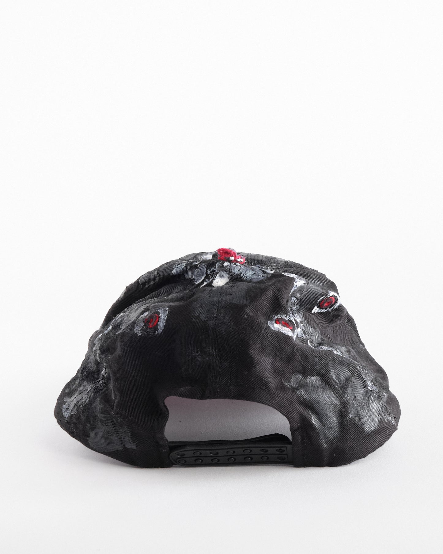 Back of of Black and red Chevy Racing hat customized by ASTROBOI* with distressing, painted details, glossy resin visor, and stainless steel piercings.