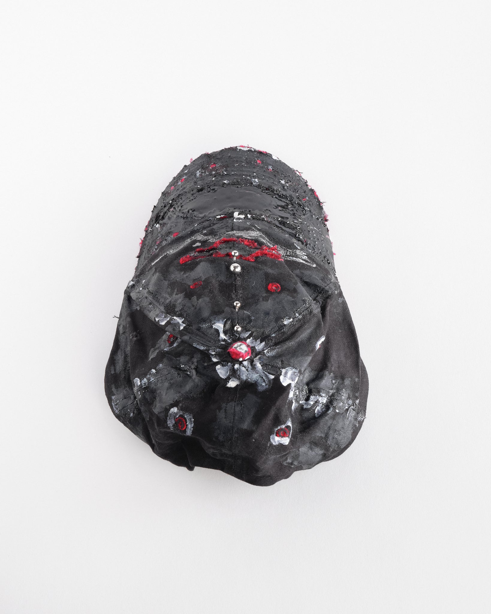 Back top of Black and red Chevy Racing hat customized by ASTROBOI* with distressing, painted details, glossy resin visor, and stainless steel piercings.