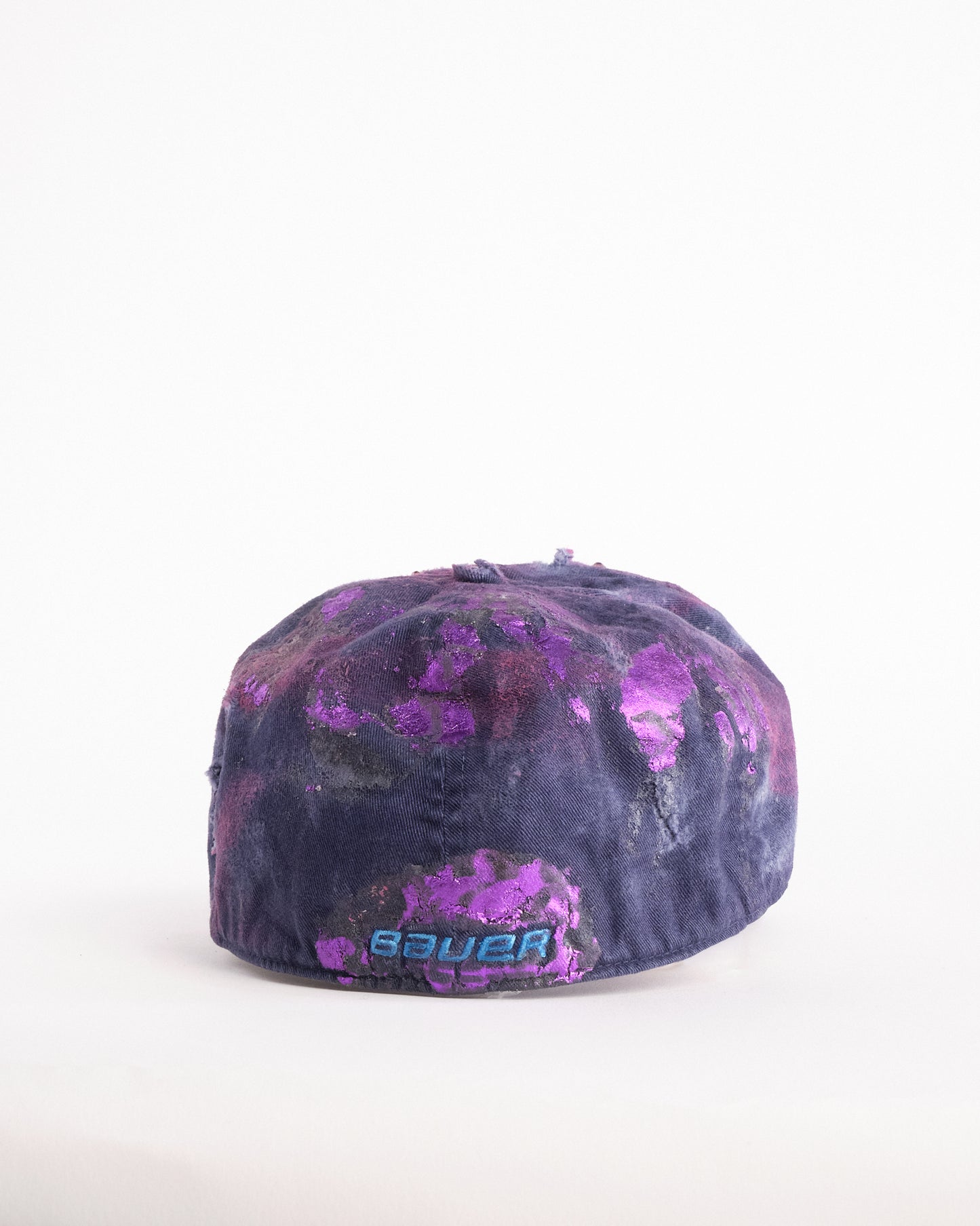 Back of ASTROBOI* x Bauer purple distressed hat with metallic paint detailing, clustered rhinestones, and closed-back fit, handmade and customized in NYC.