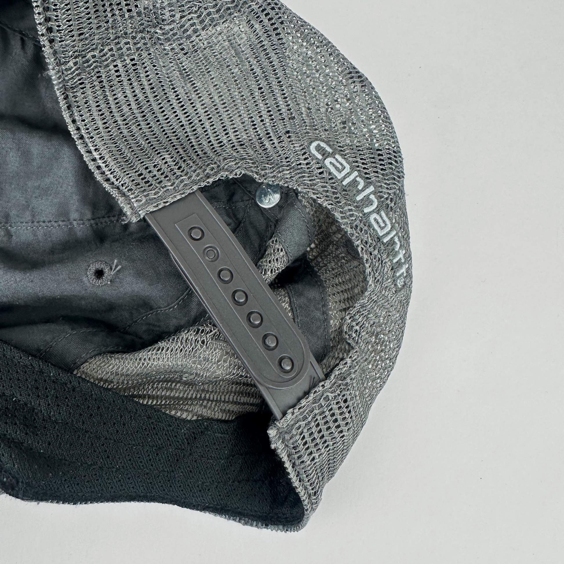 ASTROBOI* x Carhartt 'Amethyst' gray and purple distressed studded hat, close up of rear view showing frayed mesh back panel and adjustable strap.