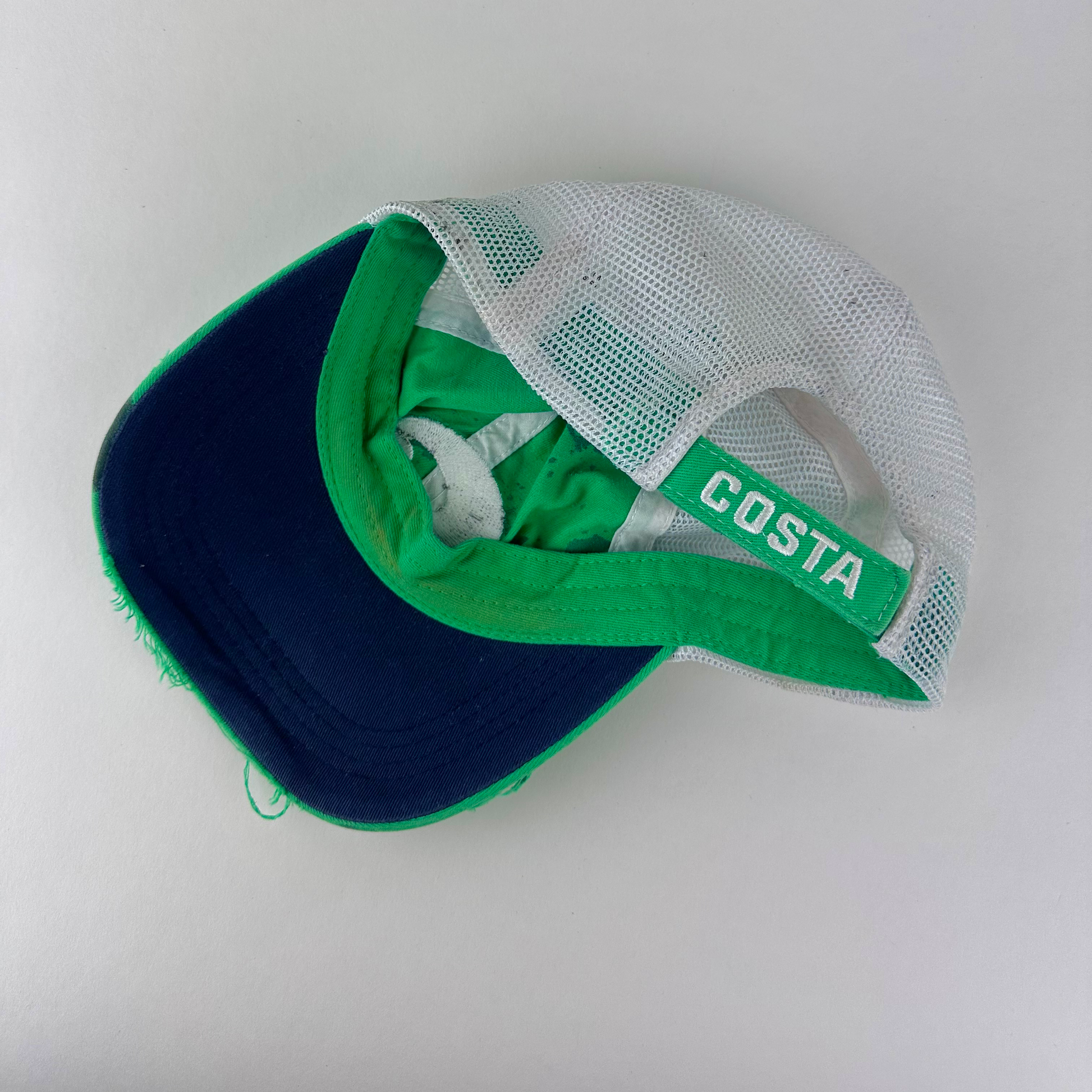 ASTROBOI* x Costa del Mar 'Jade' Y2K green rhinestone studded trucker hat, rear view showing white mesh back panel with Costa embroidered logo and adjustable strap.
