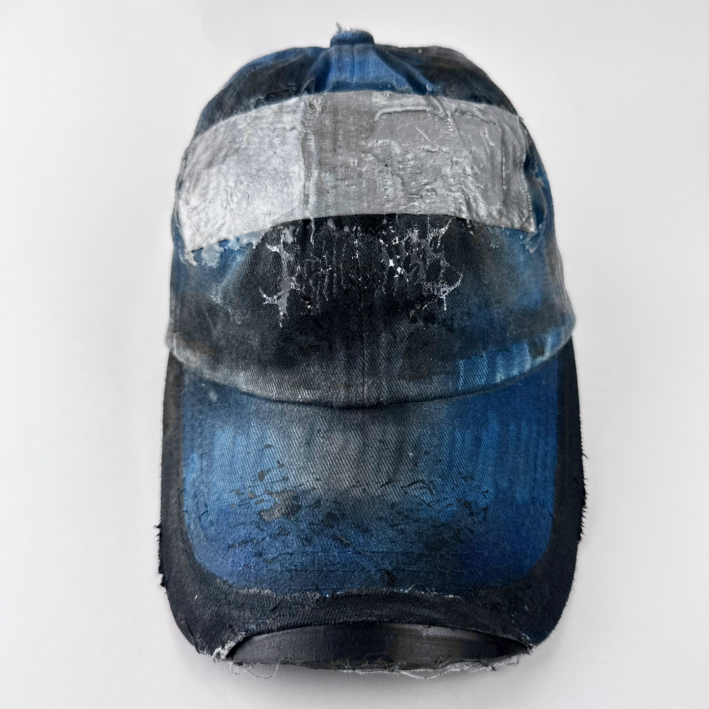 ASTROBOI* 'Duct' black and blue grunge denim hat with barbed wire design at front, melted duct tape sealed under resin, and deconstructed visor, front view cover image.