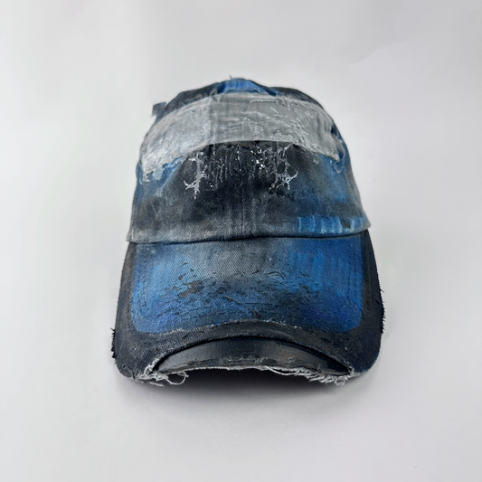 ASTROBOI* 'Duct' black and blue grunge denim hat with barbed wire design at front, melted duct tape sealed under resin, and deconstructed visor, front view two.