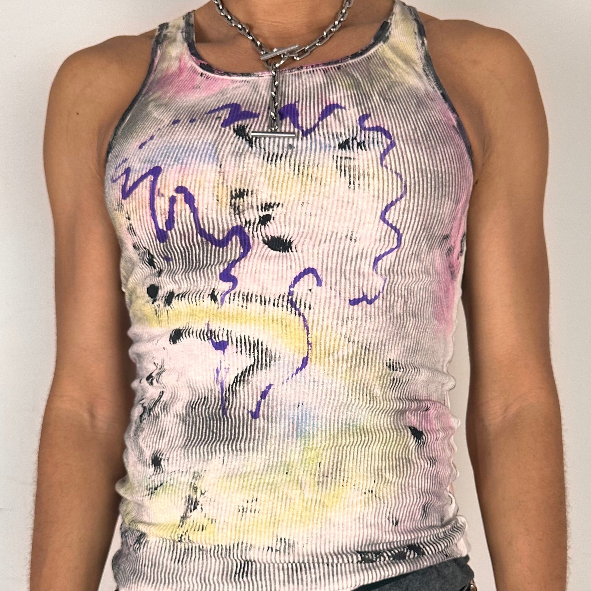Close up of ASTROBOI* x Hanes 'Plum' white slim-fit tank top with hand-painted multicolor abstract scribble graphic in pink, yellow, blue, and purple, customized at ASTROBOI* STUDIO in NYC.