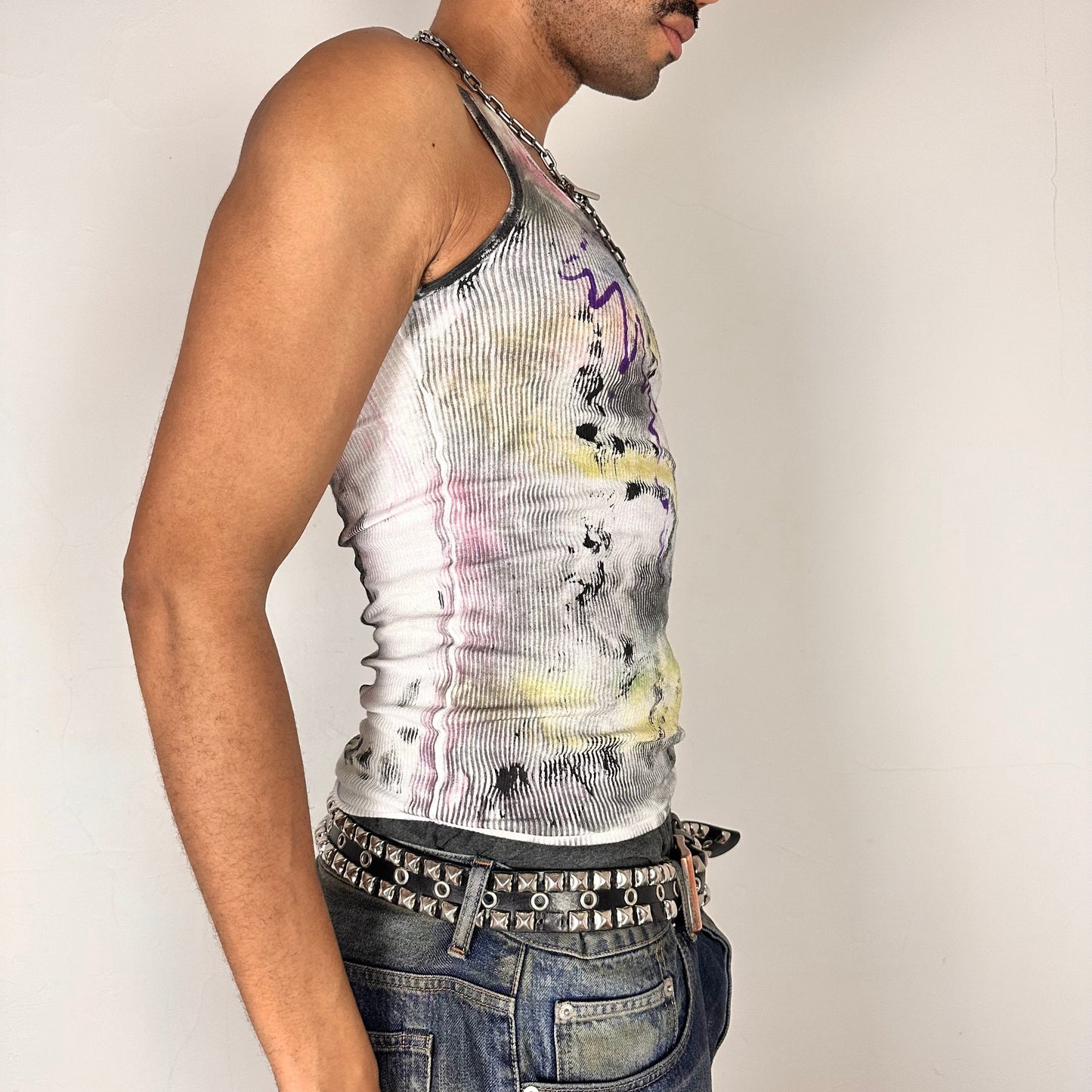 Right side of ASTROBOI* x Hanes 'Plum' white slim-fit tank top with hand-painted multicolor abstract scribble graphic in pink, yellow, blue, and purple, customized at ASTROBOI* STUDIO in NYC.