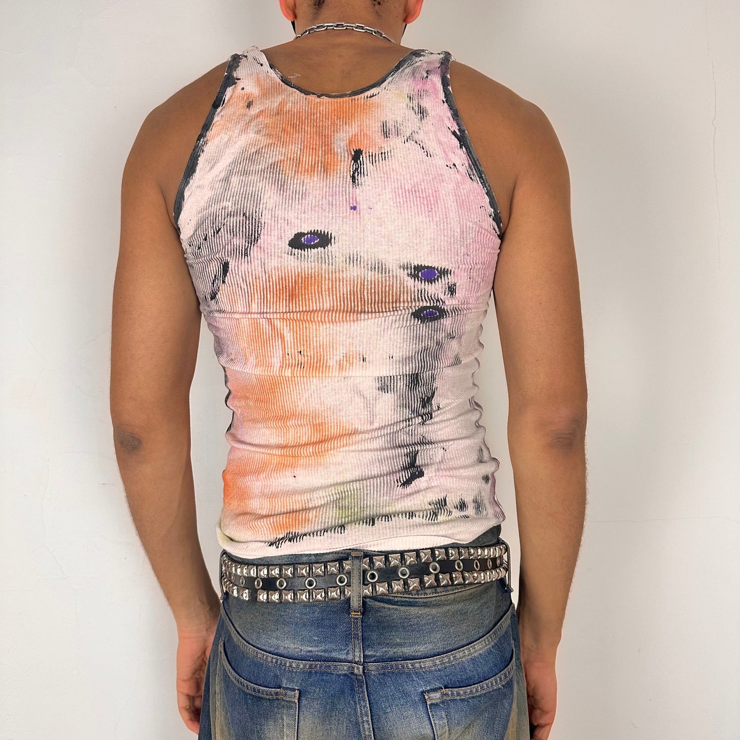 Back of ASTROBOI* x Hanes 'Plum' white slim-fit tank top with hand-painted multicolor abstract scribble graphic in pink, yellow, blue, and purple, customized at ASTROBOI* STUDIO in NYC.