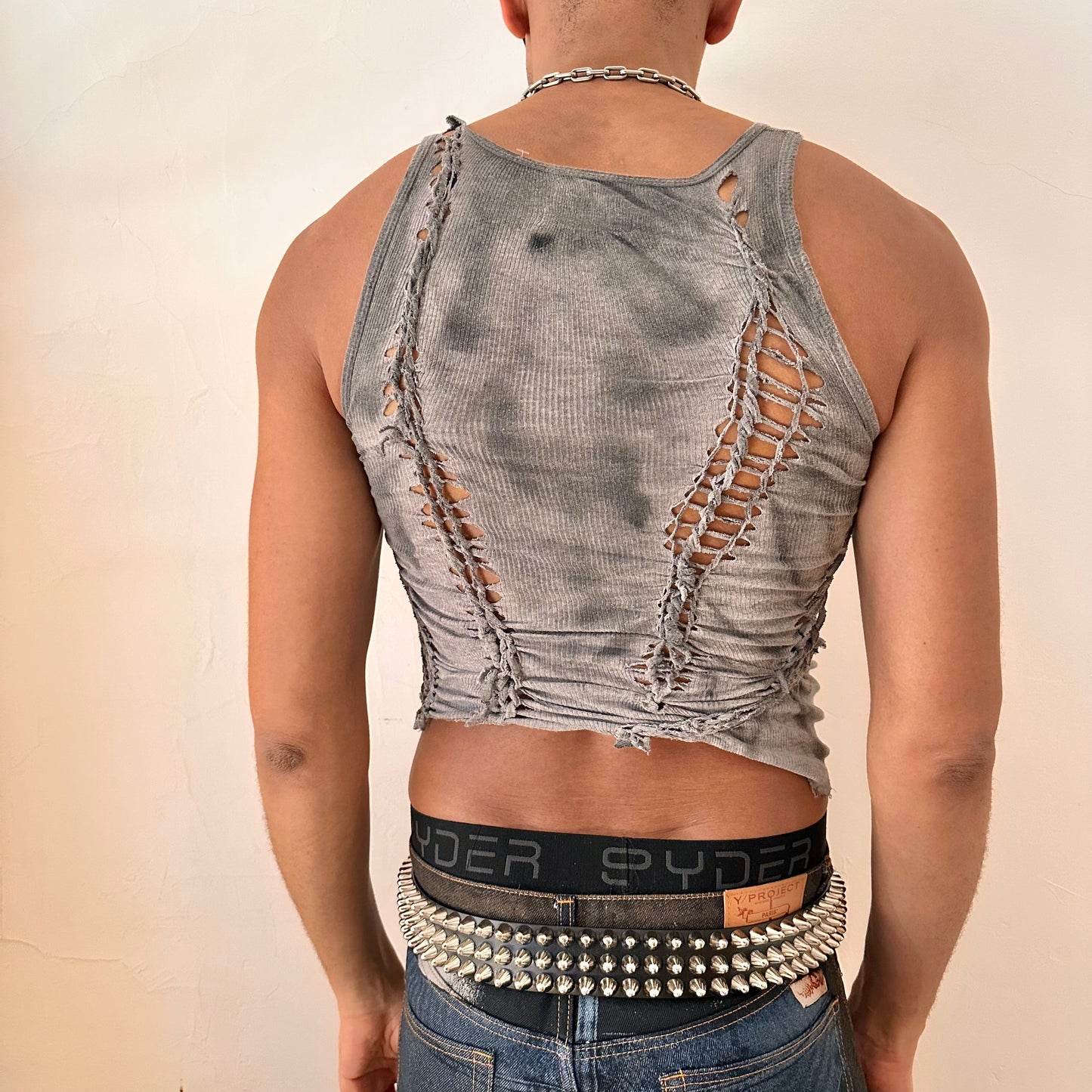 ASTROBOI* x Gildan 'Stone' antique gray braided twist tank top, rear view showing braid, knot, cut-out, and tonal paint construction, worn by male model.