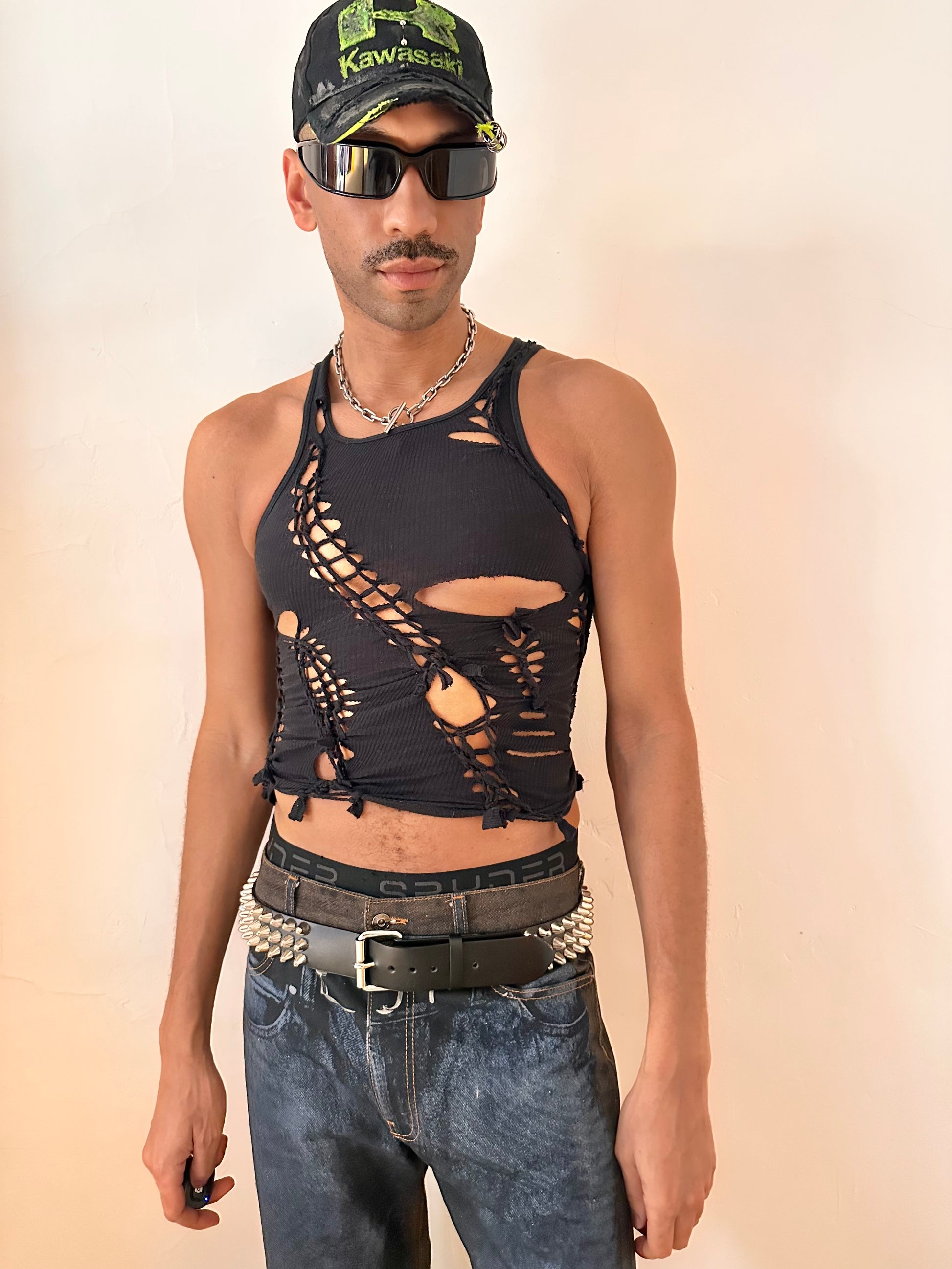 Male model wearing ASTROBOI* ‘Nightshade’ black braided tank top, styled full look, ASTROBOI* STUDIO NYC.