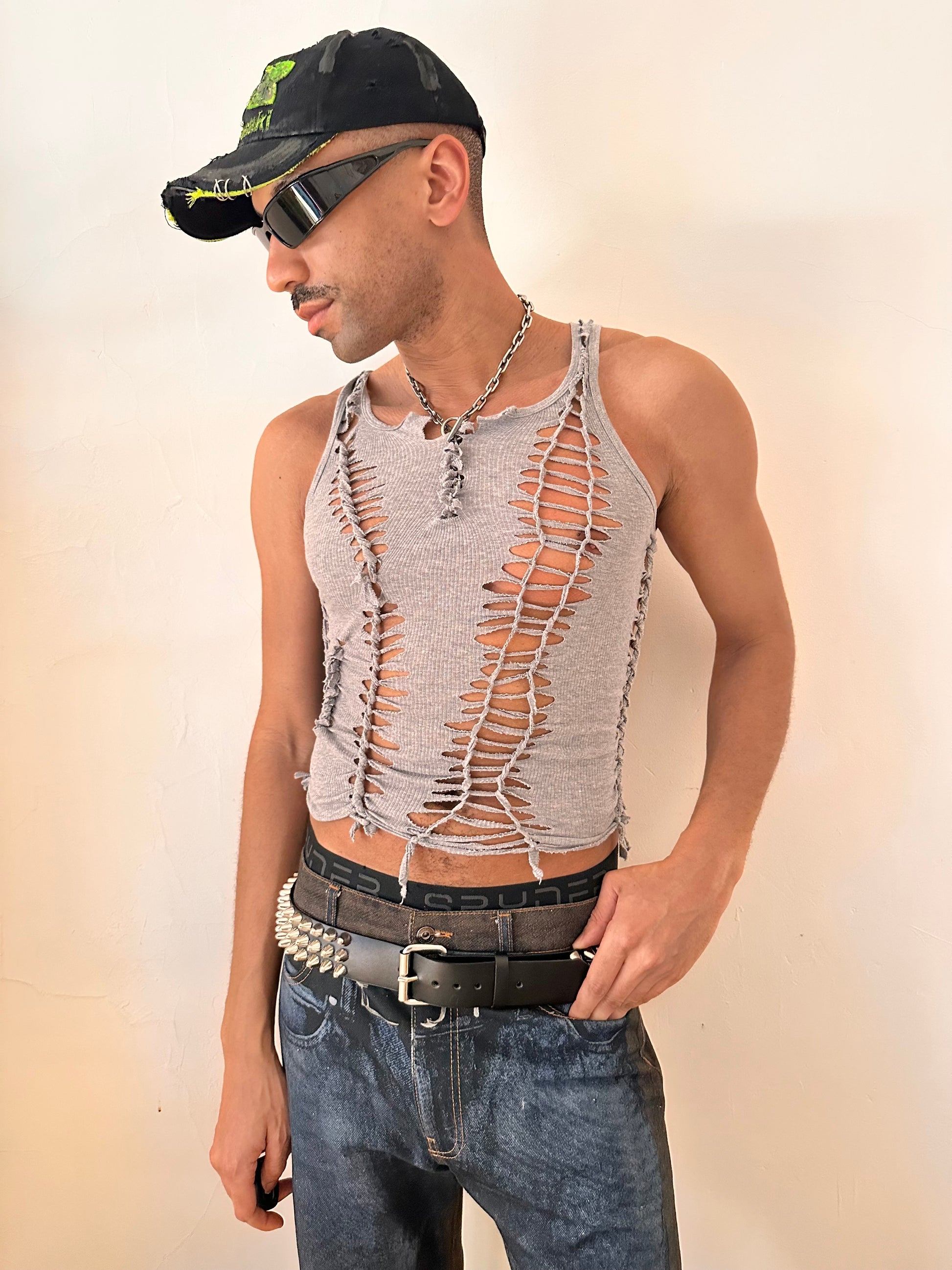 Male model wearing ASTROBOI* 'Morpheus' gray braided twist tank top, styled full look, ASTROBOI* STUDIO NYC.