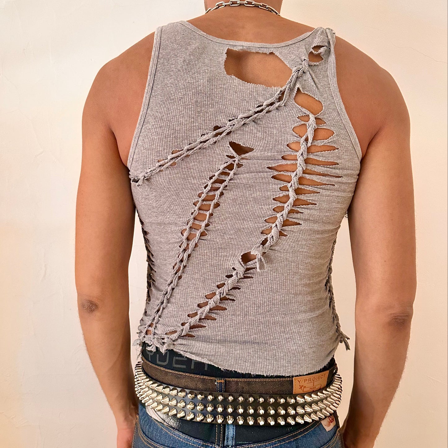 ASTROBOI* 'Morpheus' gray braided twist tank top, rear view showing braid, knot, and cut-out construction, worn by male model.